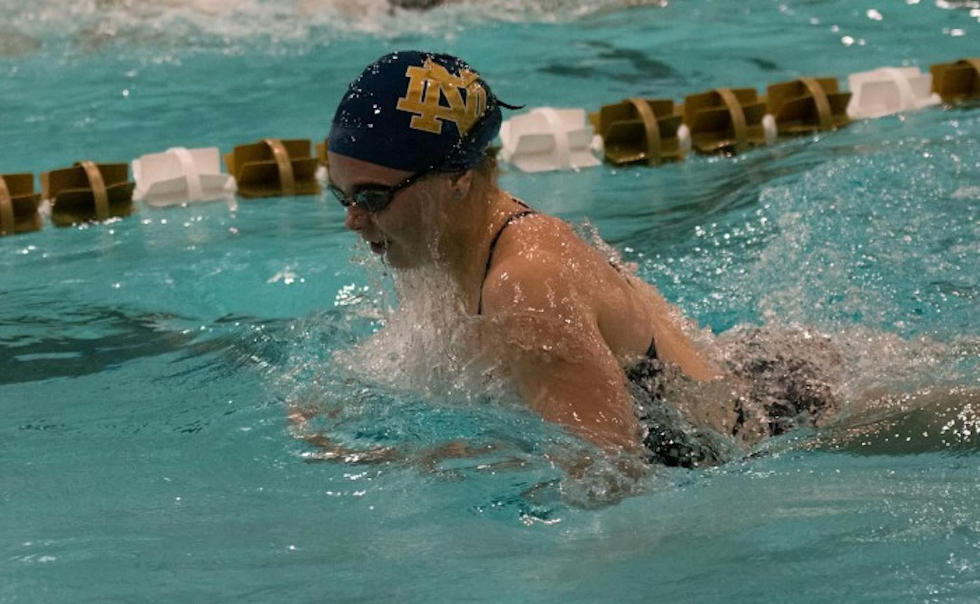 Irish junior Genevieve Bradford takes a breath before finishing third in 100-yard breaststroke during Notre Dame’s meet against in-state rival Purdue on Nov. 1. The Irish dropped the dual meet at Rolfs Aquatic Center, 170-128.