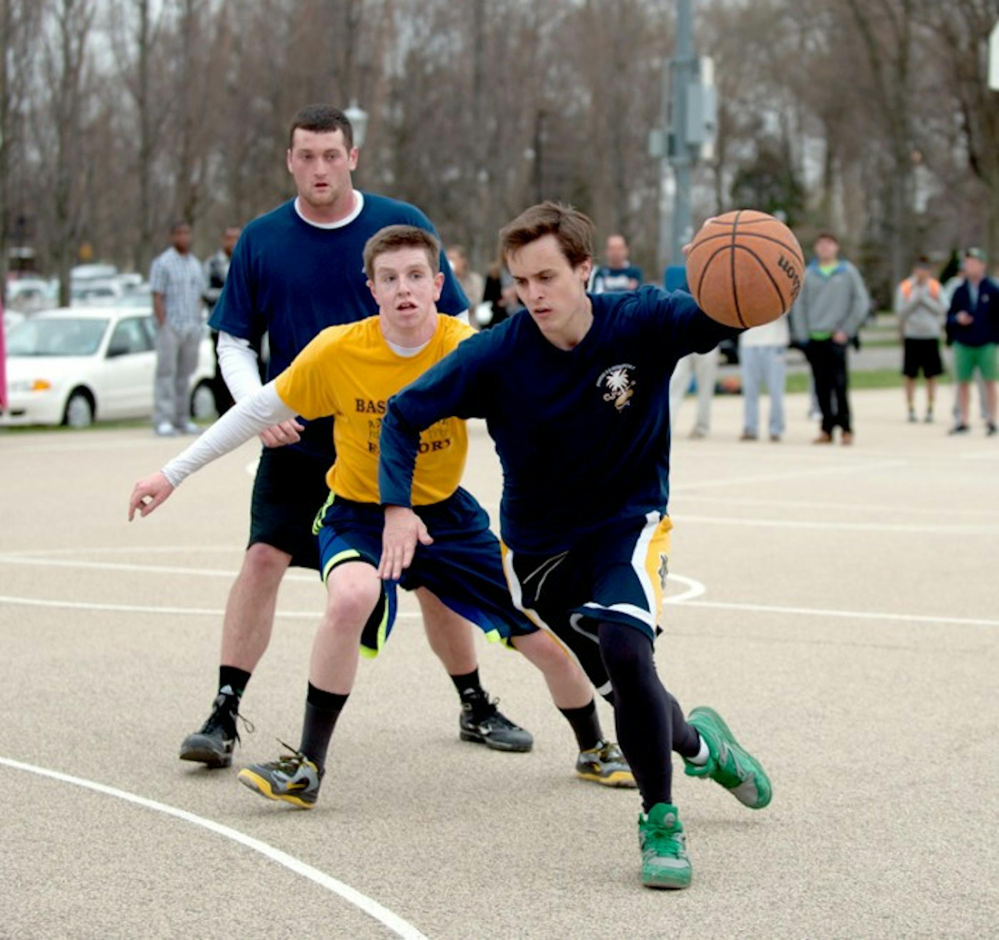 Members of CJ's Party of Five and Touchdown 3s battle during the Elite Eight of Bookstore Basketball. Touchdown 3s won the game, 21-12, and advanced to the Final Four.
