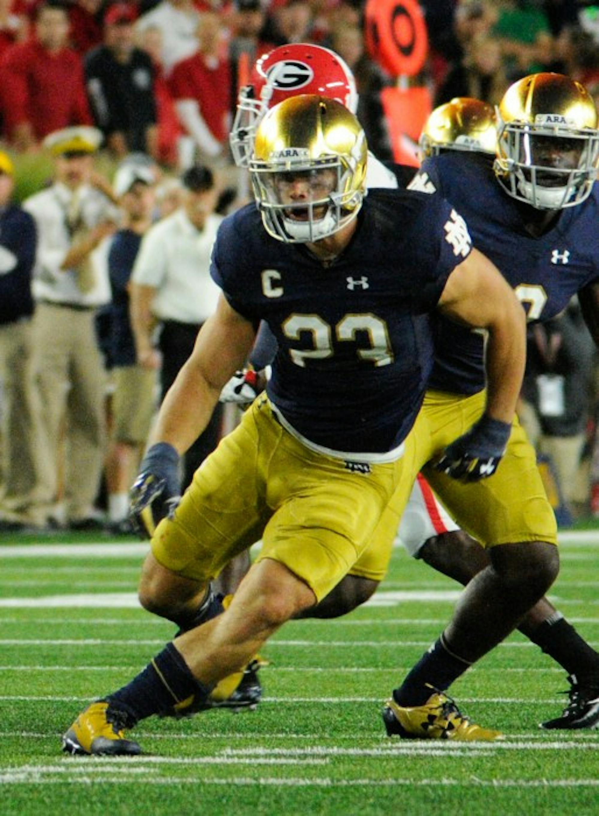 Senior linebacker Drue Tranquill goes in for a tackle during Notre Dame’s 20-19 loss to Georgia on Saturday at Notre Dame Stadium.
