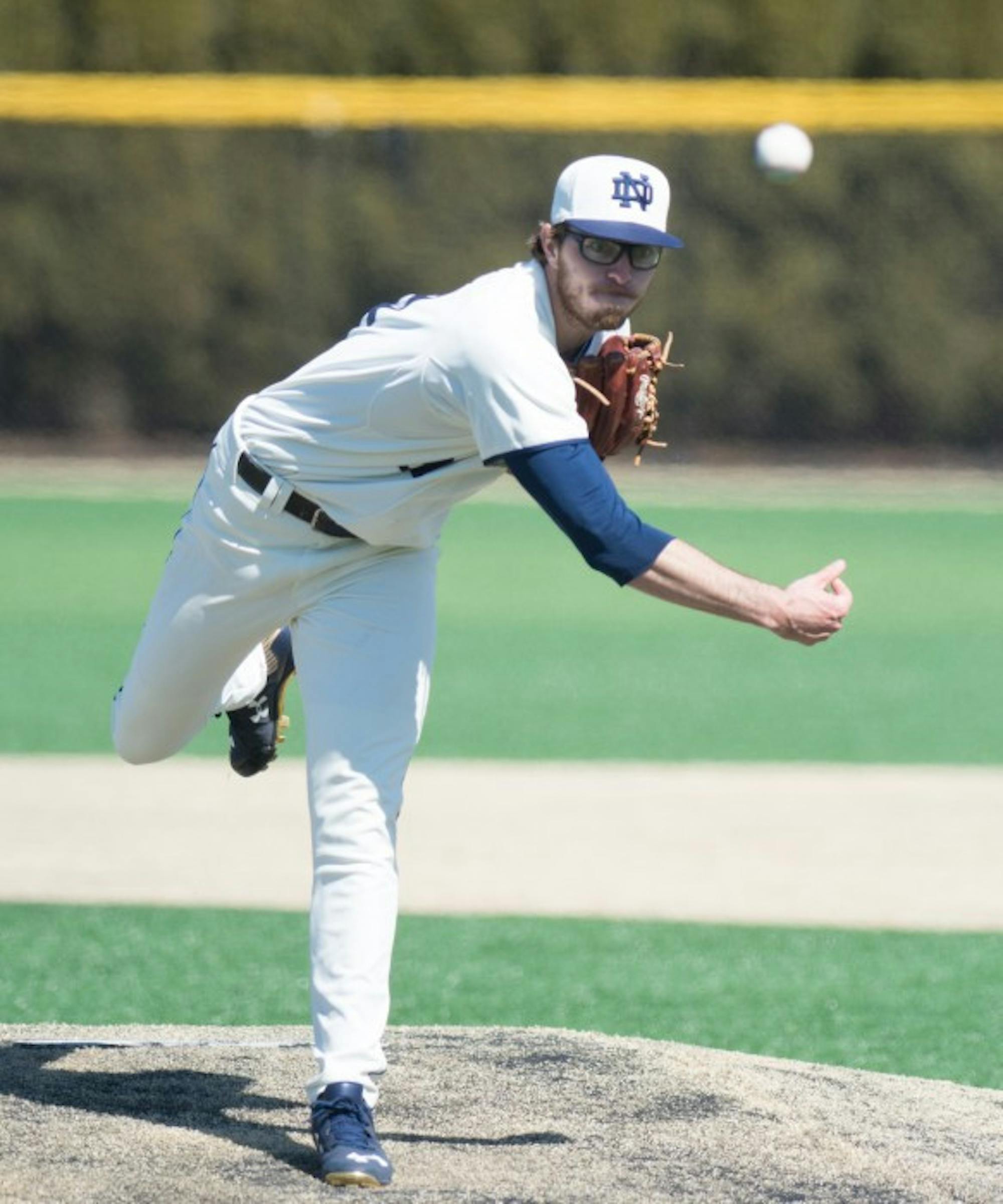 Senior pitcher Scott Kerrigan throws a pitch in a 4-2 loss to  Virginia on Mar. 28 at Frank Eck Stadium.