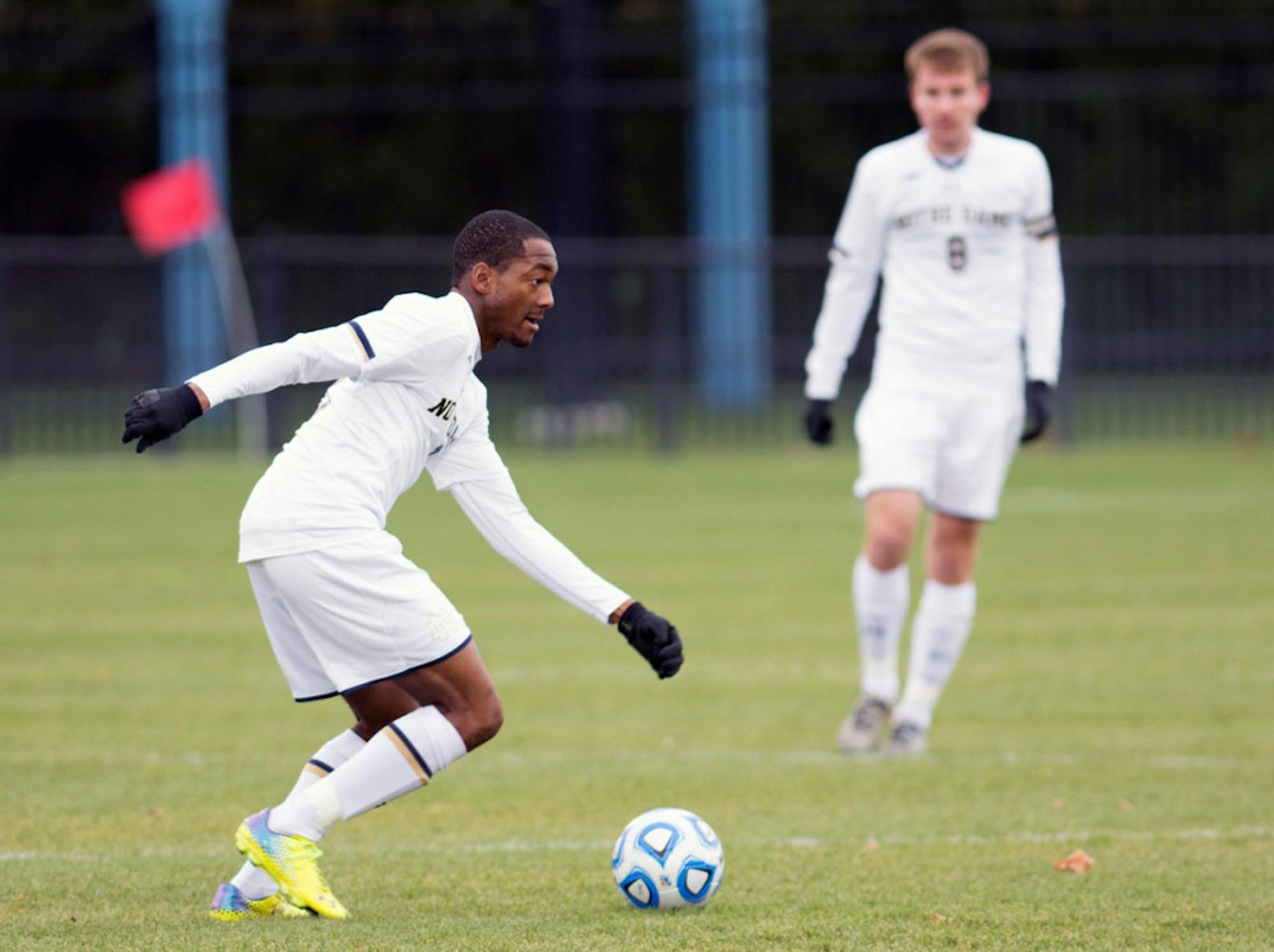 Irish graduate student forward Leon Brown decides his next move during the 3-0 win against Virginia on Sunday at Alumni Stadium.