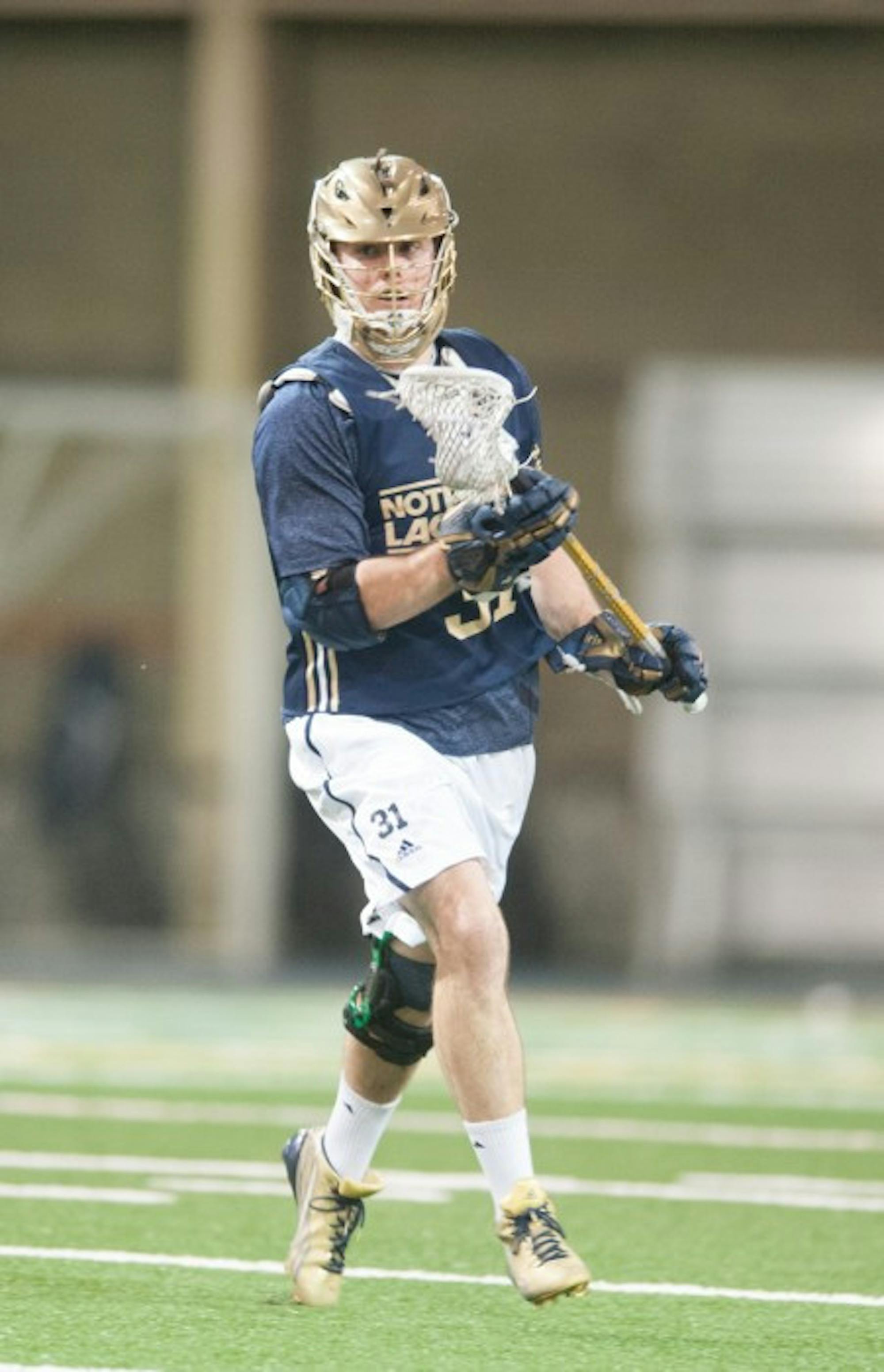 Irish midfielder Liam O’Connor moves upfield in a scrimmage against Detroit on February 2. The senior has won 70 percent of his faceoffs this season.