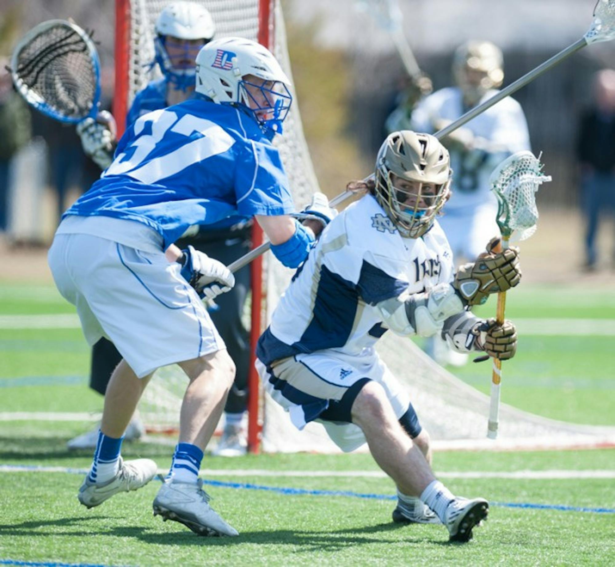 Irish sophomore attackman Matt Kavanagh dodges a Duke defender in Notre Dame’s 15-7 loss at the hands of the Blue Devils. Kavanagh added two goals Tuesday, bringing his season total to a team-high 20.