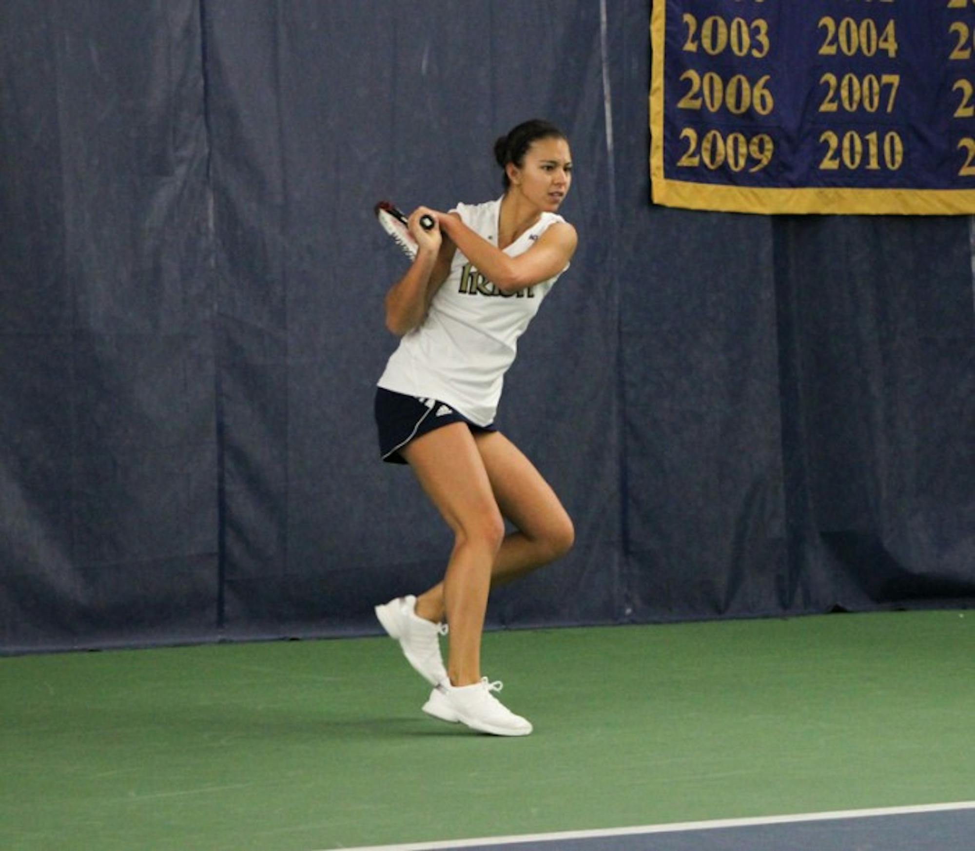 Senior Britney Sanders follows through her backhand in a match against Indiana on Sunday. The Irish defeated the Hoosiers 4-3.