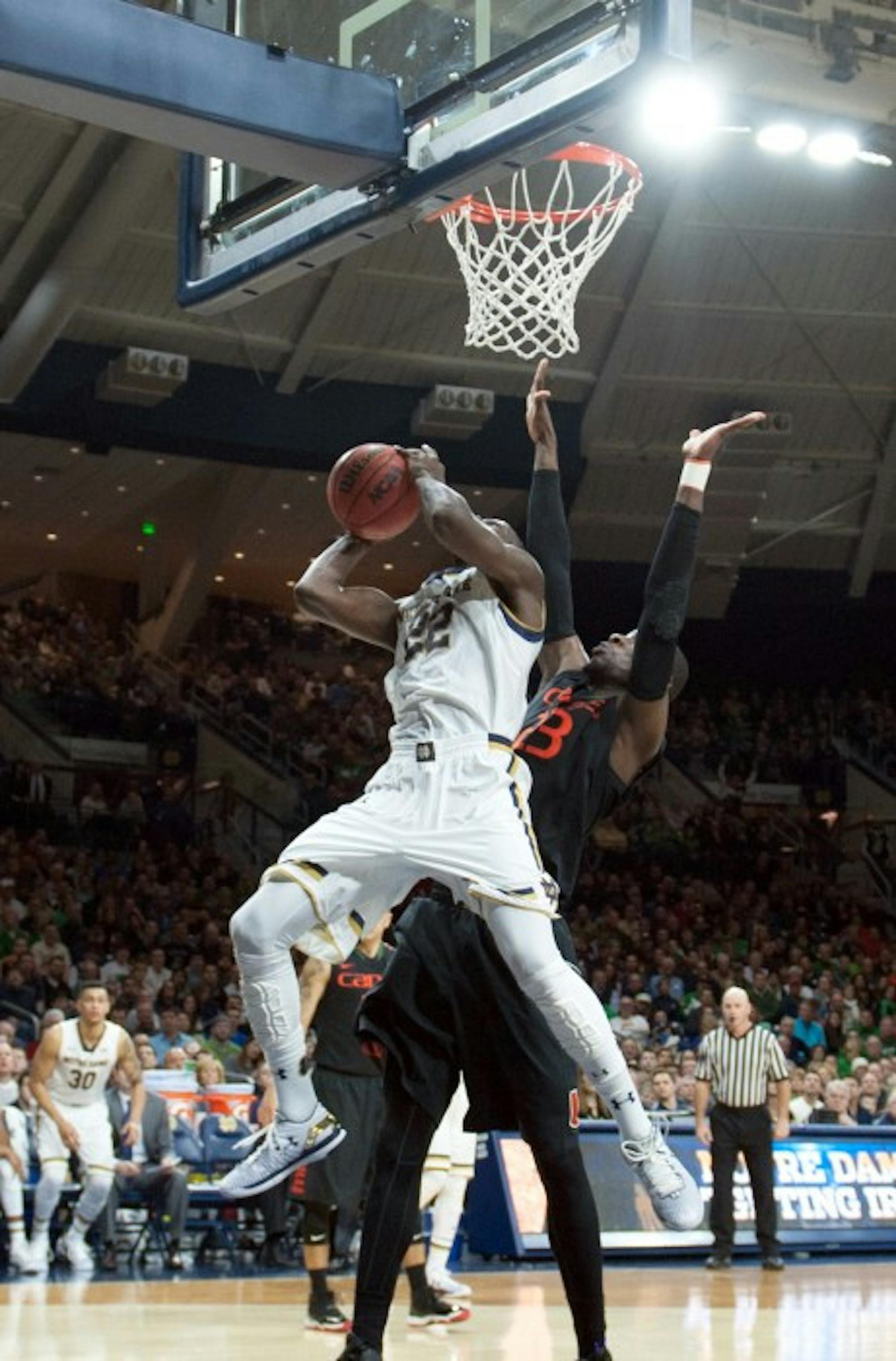 Irish senior guard Jerian Grant scores a bucket against traffic during Notre Dame's 75-70 win over Miami on Saturday at Purcell Pavilion.