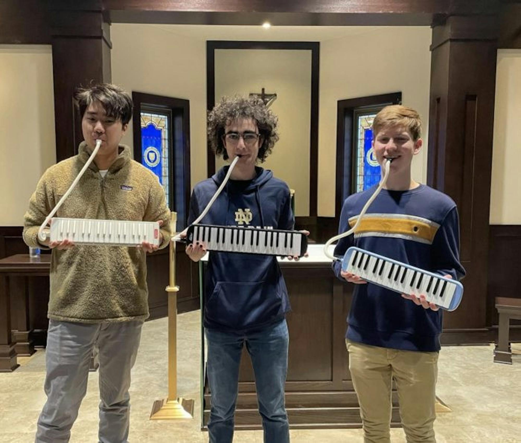 Heine Borel band members Bill Kim (left to right), Anthony Masso-Rivetti and Gabe Sargent pose with their melodicas while practicing for the performance.