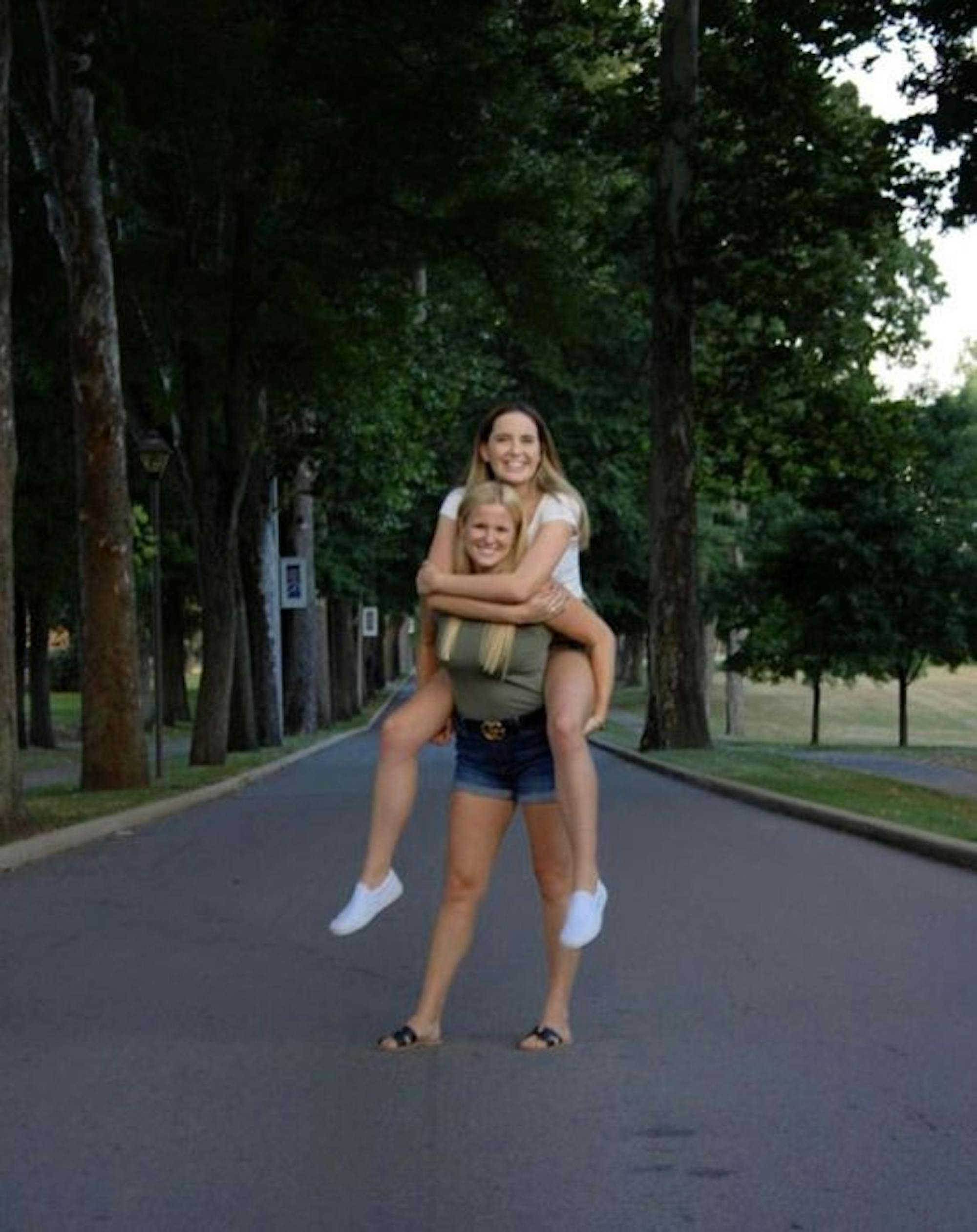 Hannah Yeager (front) and Veronica Blackburn (back) pose at the entrance to the Avenue. The pair is running for SGA president and vice president, respectively.