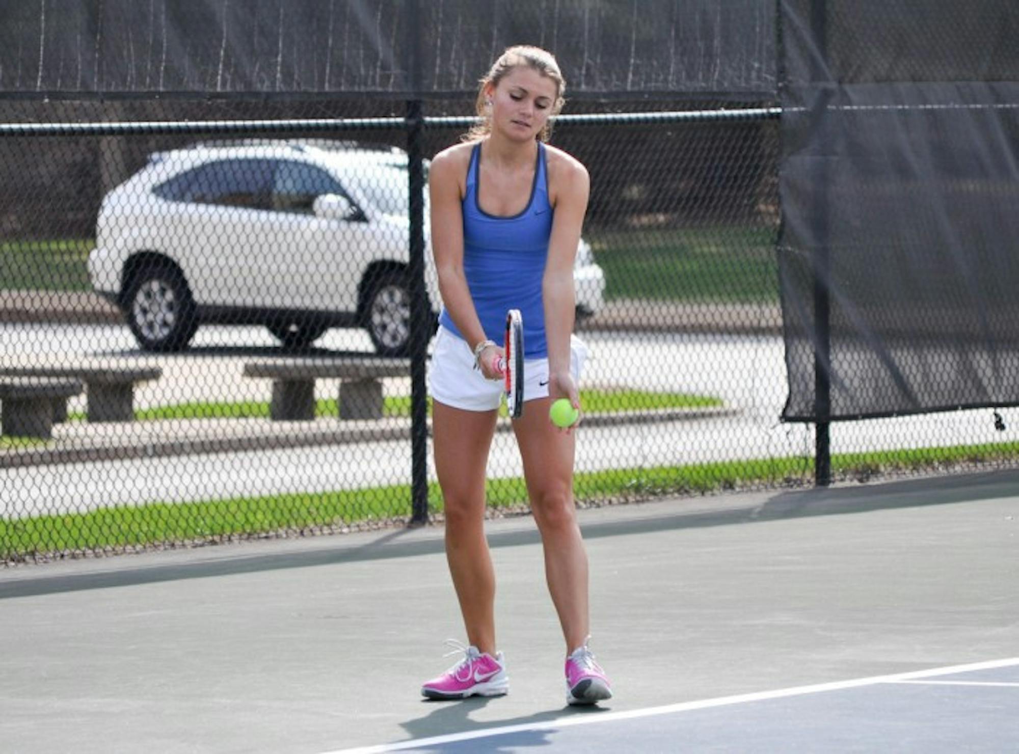Senior captain Kayle Sexton prepares to serve in a match against Hope on April 17. Sexton won her match Wednesday 6-1, 6-2.