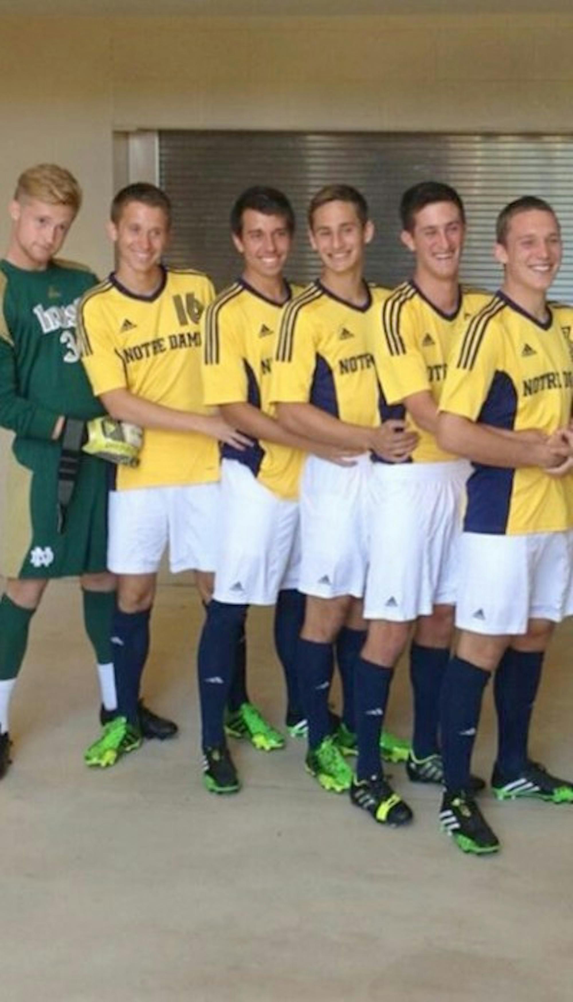 The Irish juniors pose for a prom-style photo. Midfielder Connor  Klekota said the group takes the same photo annually as a tradition.