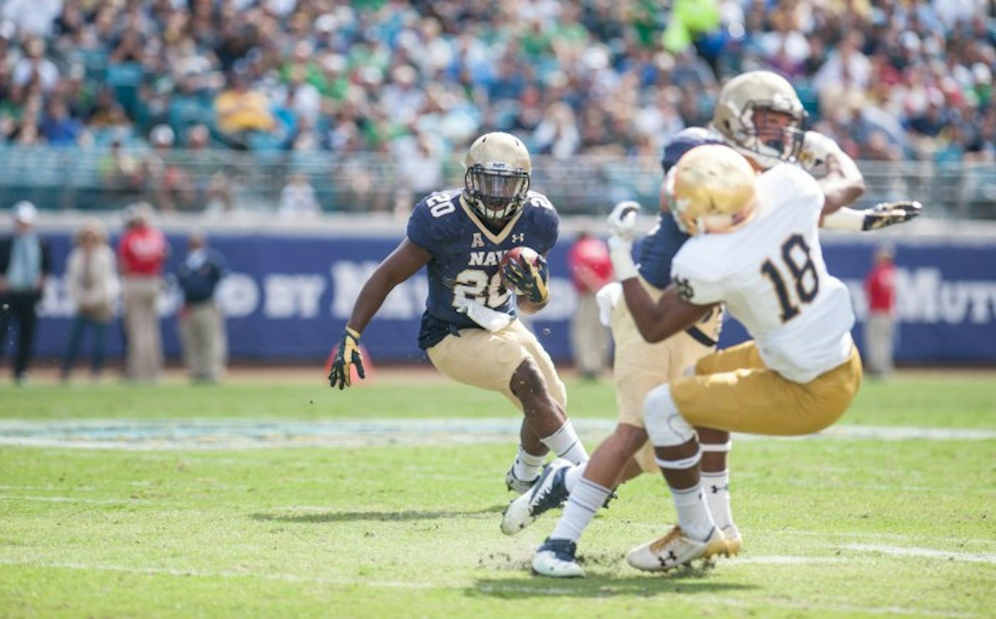 Senior Calvin Cass Jr. of Navy runs for a 37 yard touchdown to give Navy a 21-17 lead with 11:08 left in the 3rd Quarter. ND Freshmen CB Troy Pride Jr. on receiving end of a hard block.