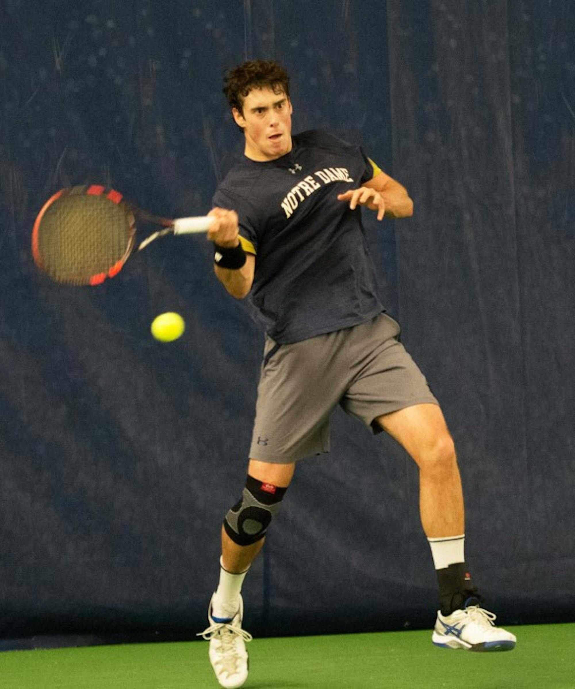 Irish junior Alex Lebedev hits a forehand during Notre Dame’s 4-1 victory over Northwestern on Feb. 24. Lebedev lost his singles match but won his doubles match with his partner, sophomore Matt Gamble.
