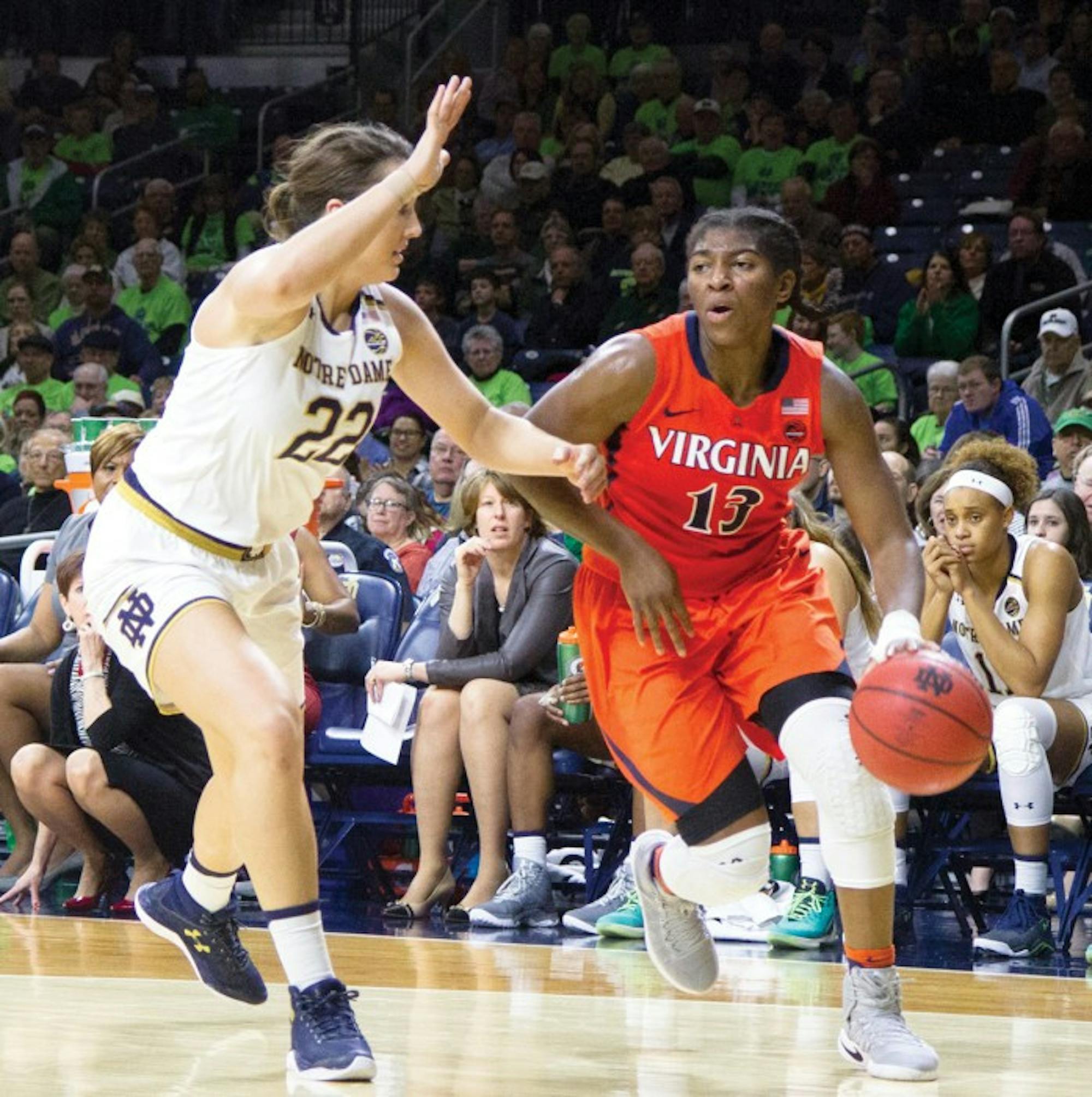 Irish freshman forward Erin Boley guards a driving Virginia player during Notre Dame's 82-74 victory over the Cavaliers on Sunday.= at Purcell Pavilion.