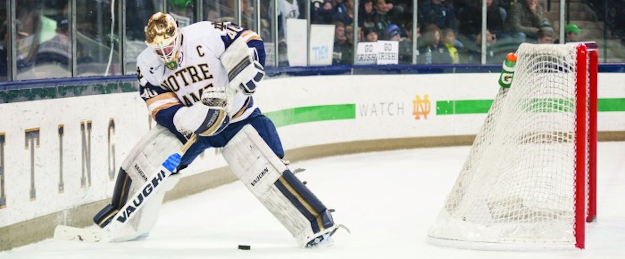 Irish junior netminder and team captain Cal Petersen attempts to gather control of a dump in during Notre Dame’s Game 1 victory over Providence on March 11 at Compton Family Ice Arena.