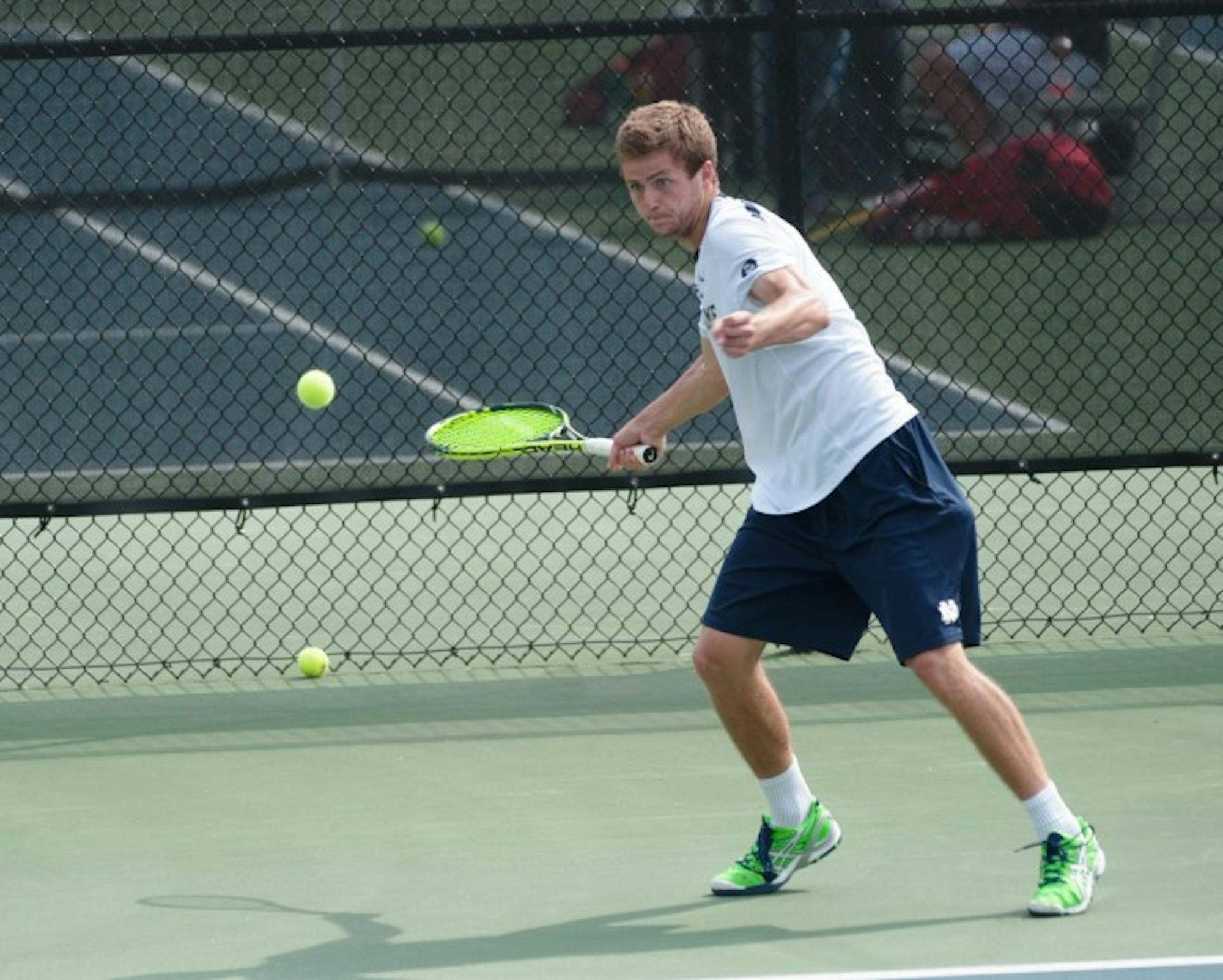 Senior Quentin Monaghan forehands the ball during Notre Dame’s 4-3 victory over North Carolina State on April 18. He will compete this weekend in both singles and doubles at the National Indoor Championships.