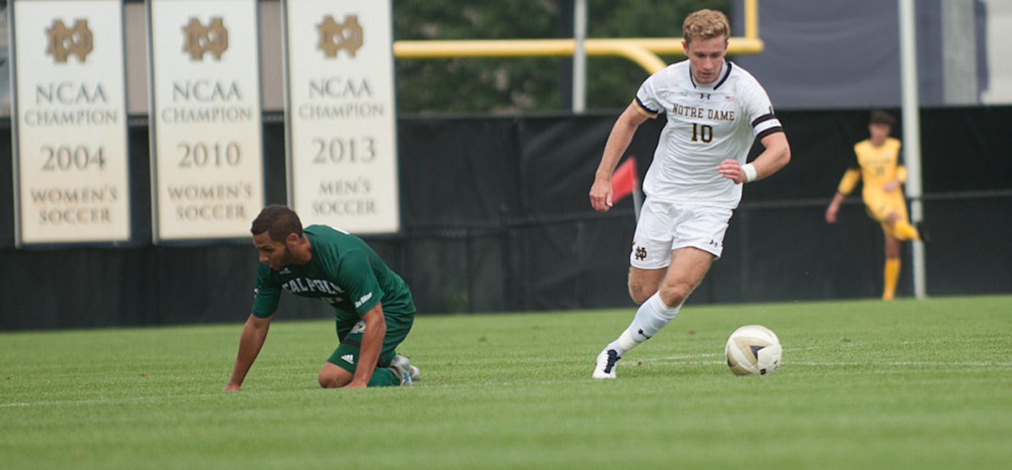 Irish captain and senior forward Jon Gallagher speeds past a fallen defender during Notre Dame’s 2-1 overtime victory over Cal Poly on Sunday at Alumni Stadium. Gallagher leads the team in shots this year.