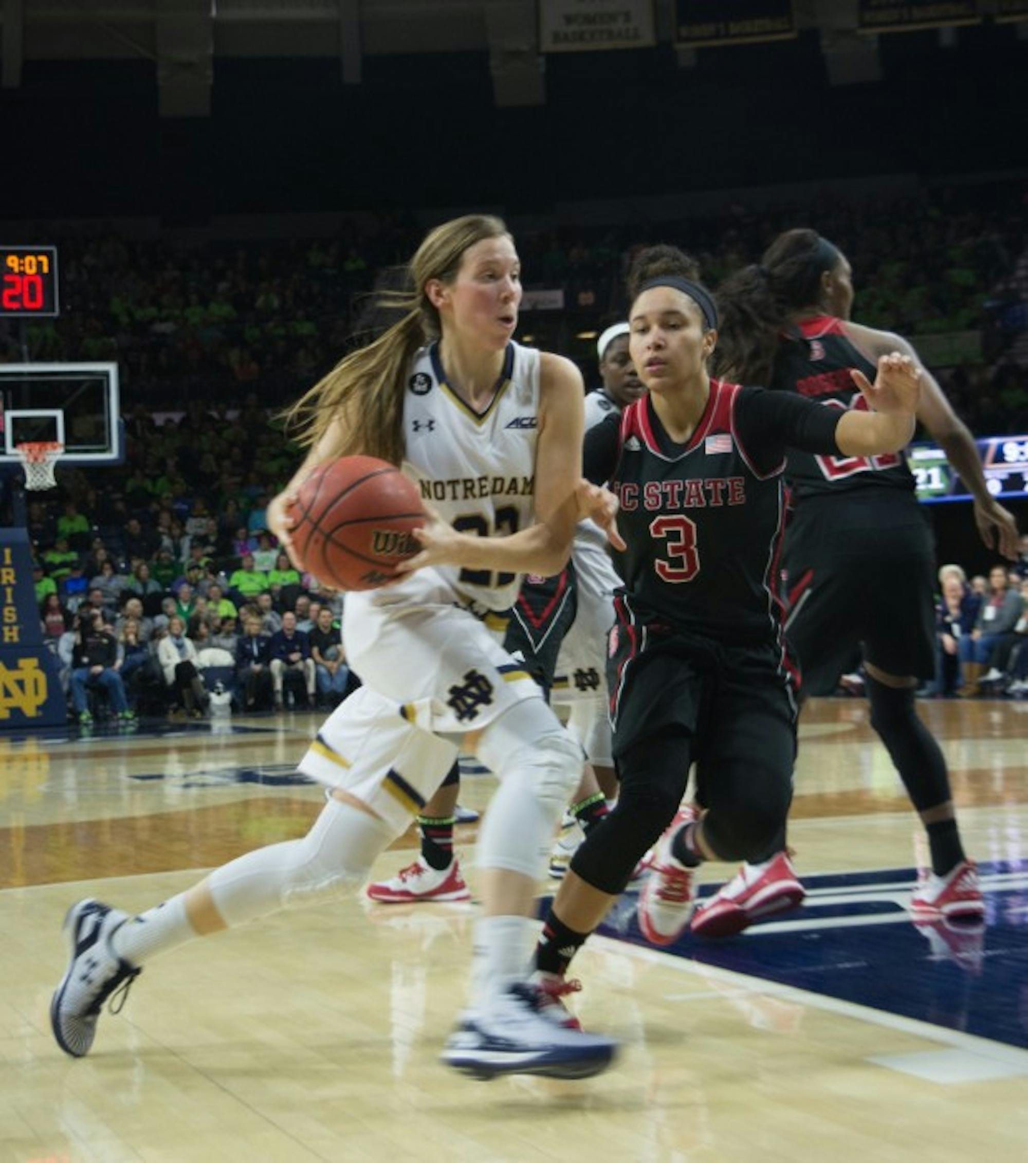 CAITLYN JORDAN | The Observer Graduate student guard Madison Cable drives to the basket during Notre Dame’s 82-46 win over NC State on Thursday at Purcell Pavilion.