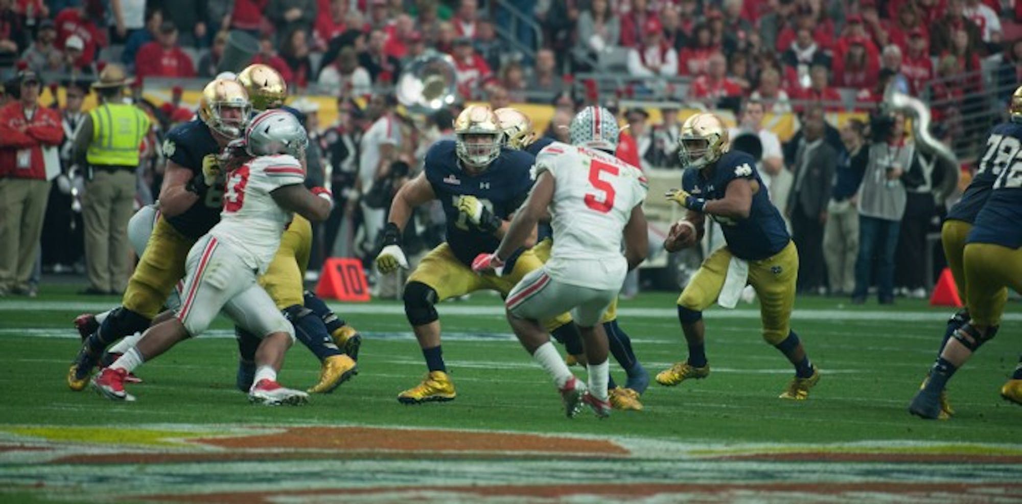 Irish junior offensive lineman Steve Elmer, left, looks to make a block during Notre Dame’s 44-28 loss to Ohio State on Jan. 1.