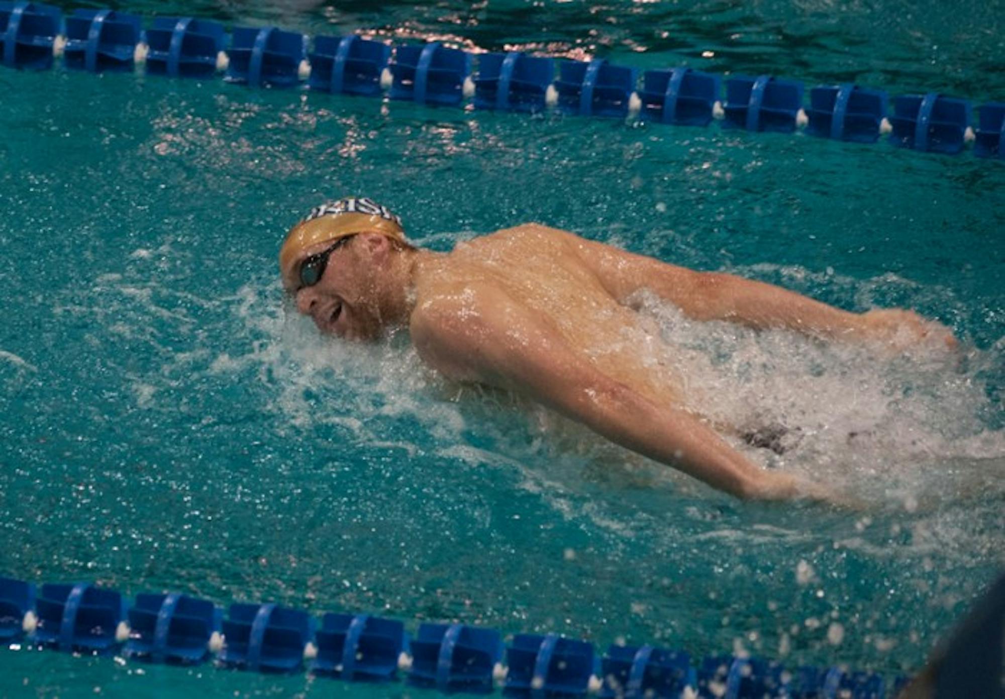 Junior Brennan Jacobsen swims against Wisconsin on Nov. 16. Jacobsen placed third in the 1,000-yard freestyle against Louisville.