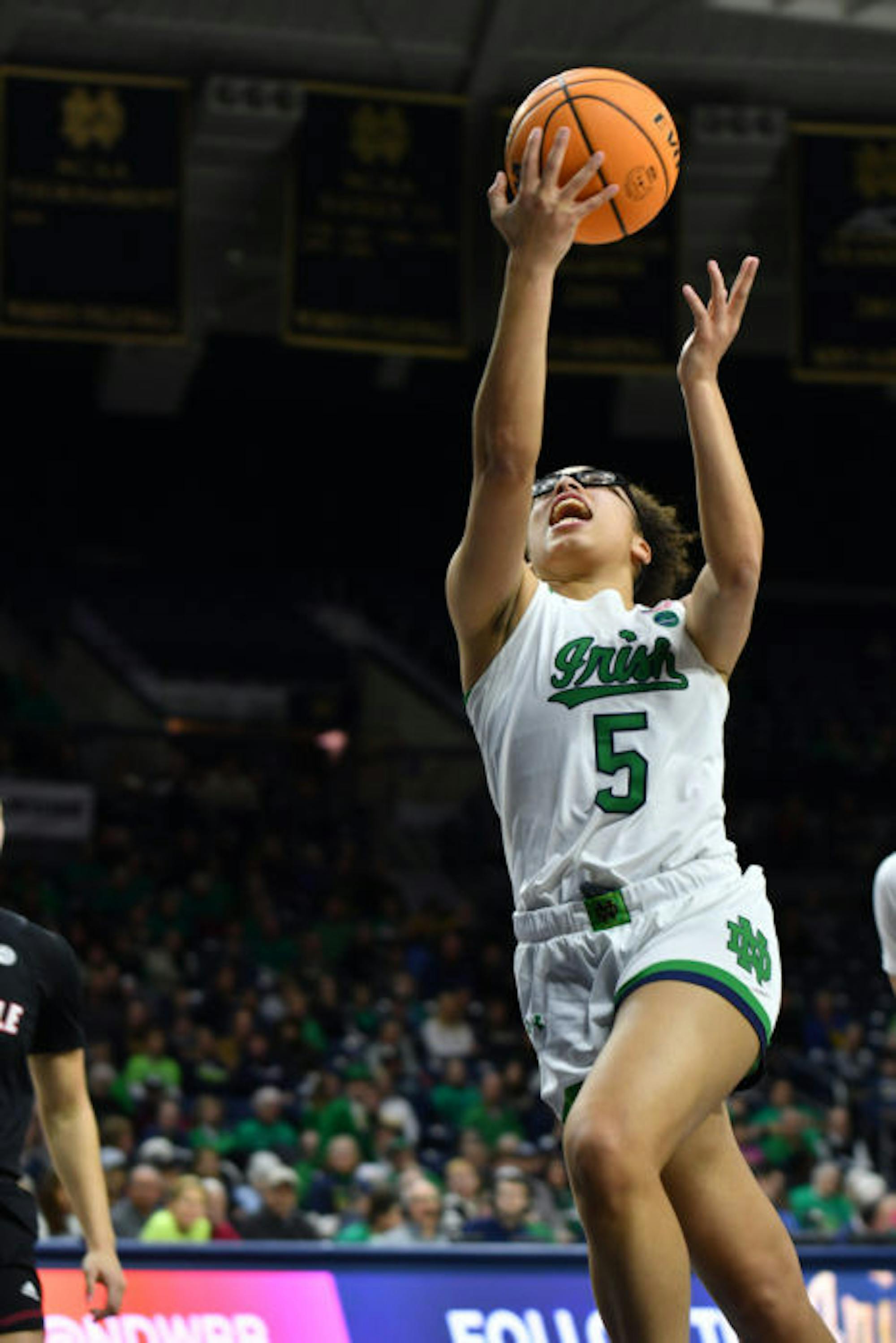 Irish sophomore guard Olivia Miles drives to the basket in Notre Dame's 78-76 overtime win over the Louisville Cardinals at Purcell Pavilion on Feb. 16, 2023.