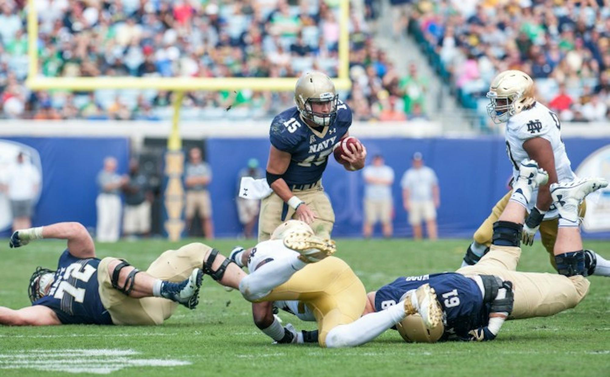 Navy QB Will Worth scrambles up the field to set Navy up for a touchdown in the beginning of the 4th Quarter.
