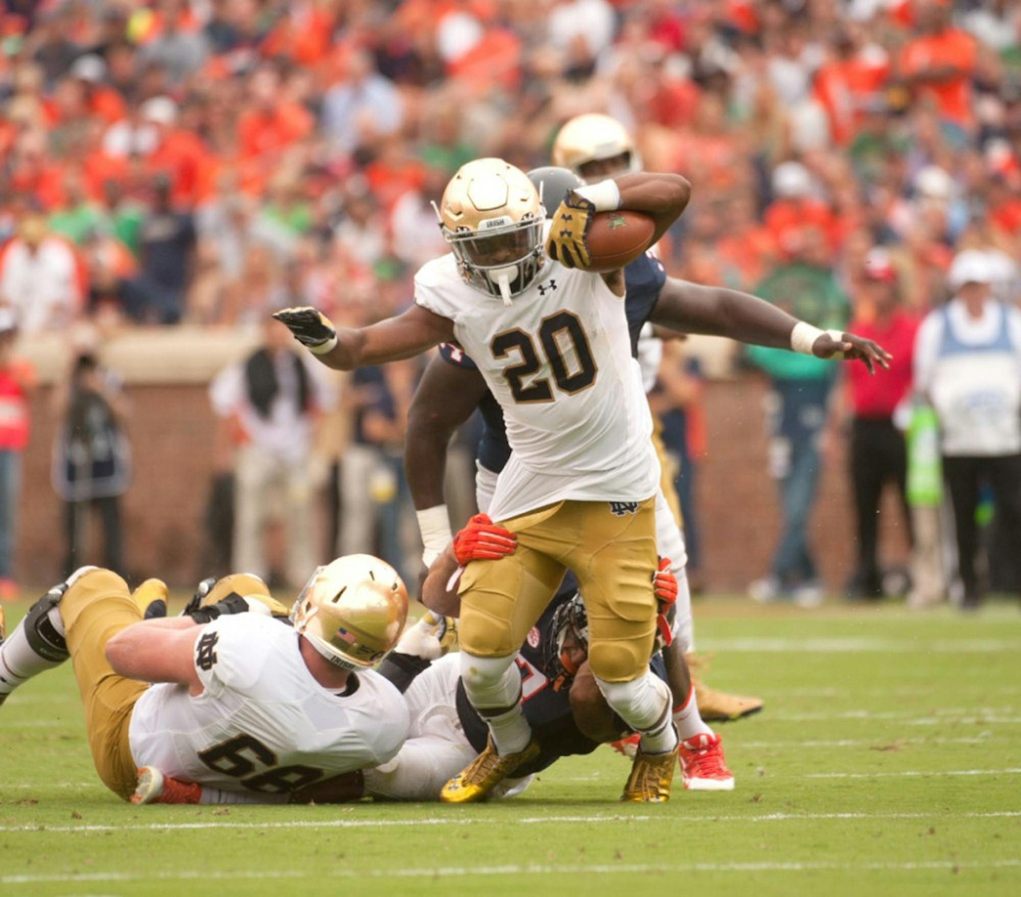 Former Irish running back C.J. Prosise breaks a tackle during Notre Dame's 34-27 win over Virginia on Sept. 12 in Charlottesville, Virginia. Prosise was the first Notre Dame running back drafted since Theo Riddick was picked in the sixth round of the 2013 NFL Draft on Friday.