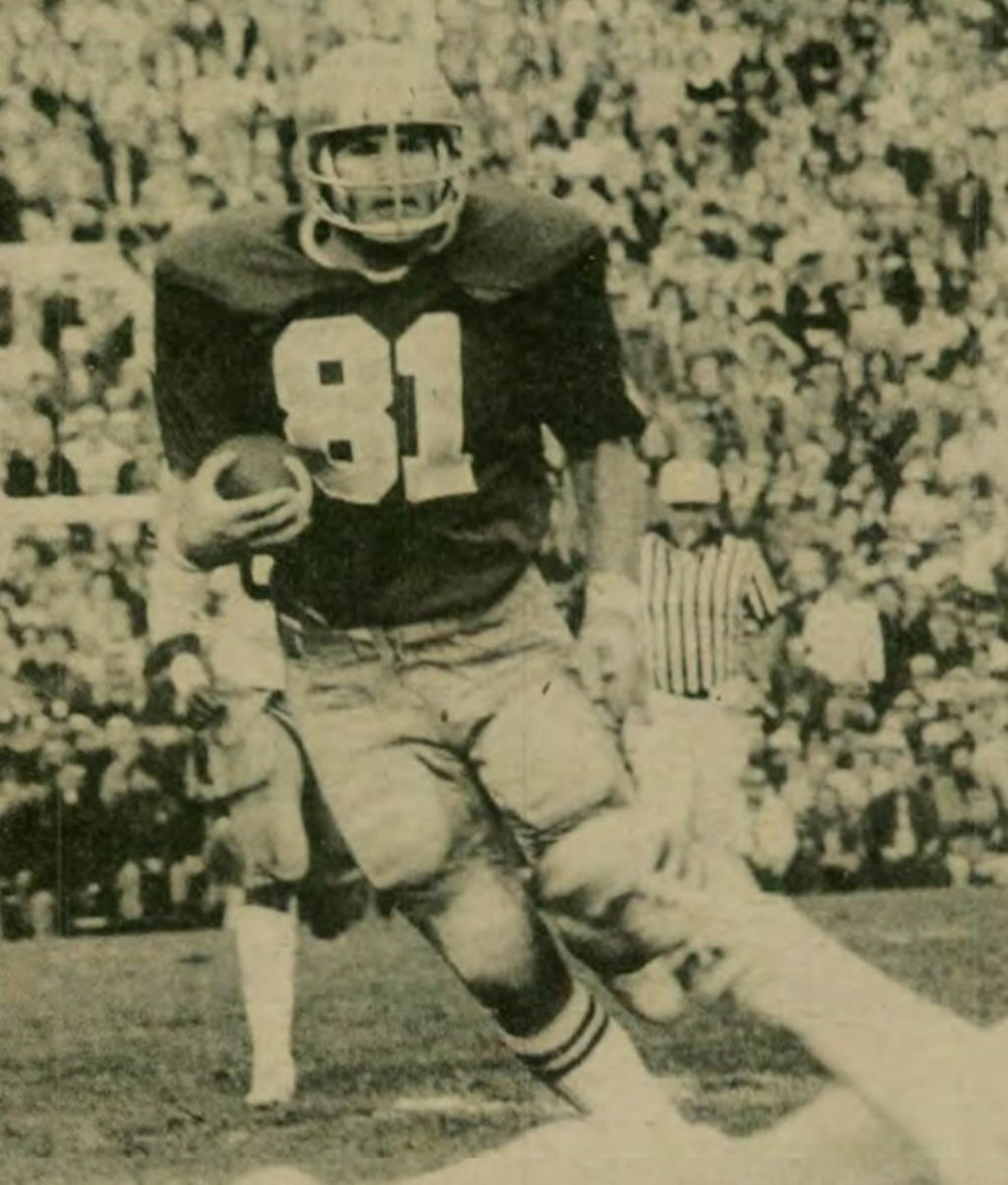 Irish tight end Ken MacAfee carries the ball during the 1976 season. MacAfee played for Notre Dame from 1974 to 1977. He was a three-time All-American and the 1977 Walter Camp Player of the Year.