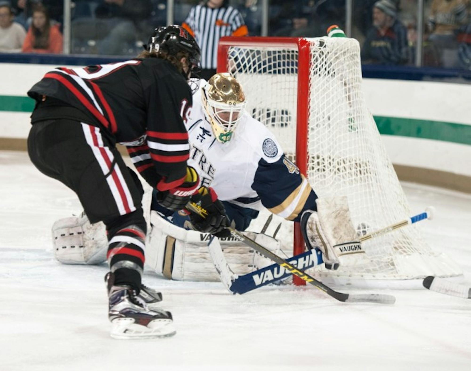 Irish sophomore goaltender Cal Petersen blocks a shot during Notre Dame’s 3-2 victory over Northeastern on Thursday night at Compton Family Ice Arena. Peterson recorded 23 saves during the game.