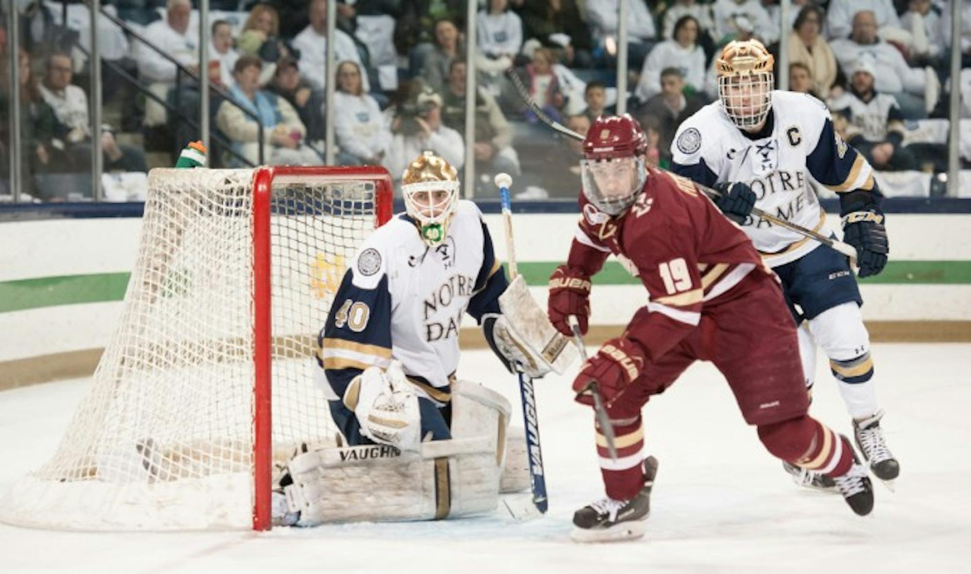 Irish freshman goaltender Cal Petersen and junior center Steven Fogarty track the puck in Notre Dame’s 2-0 loss to Boston College.