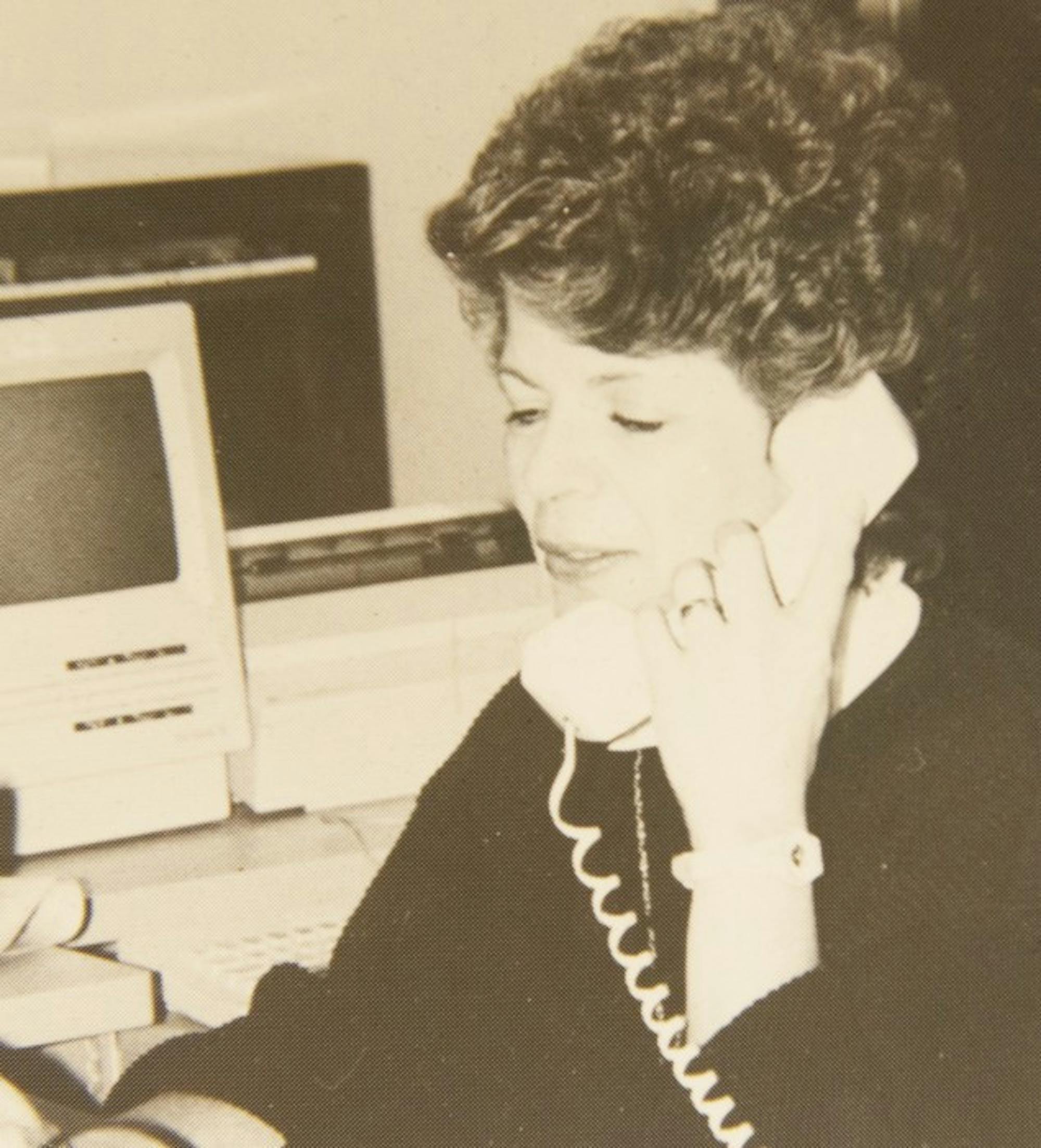 Shirley Grauel answers a phone call in this photo from the Observer's 35th anniversary issue. Grauel worked for the Observer for 30 years.