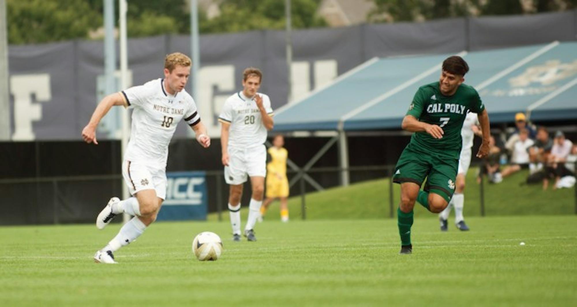 Irish senior forward Jon Gallagher dribbles the ball across the pitch during Notre Dame’s 2-1 win over Cal Poly in double overtime on Aug. 27 at Alumni Stadium. Gallagher scored his first career hat trick during Notre Dame’s 3-1 win over Boston College on Friday, scoring all three goals for the Irish and earning his first goals of the season.