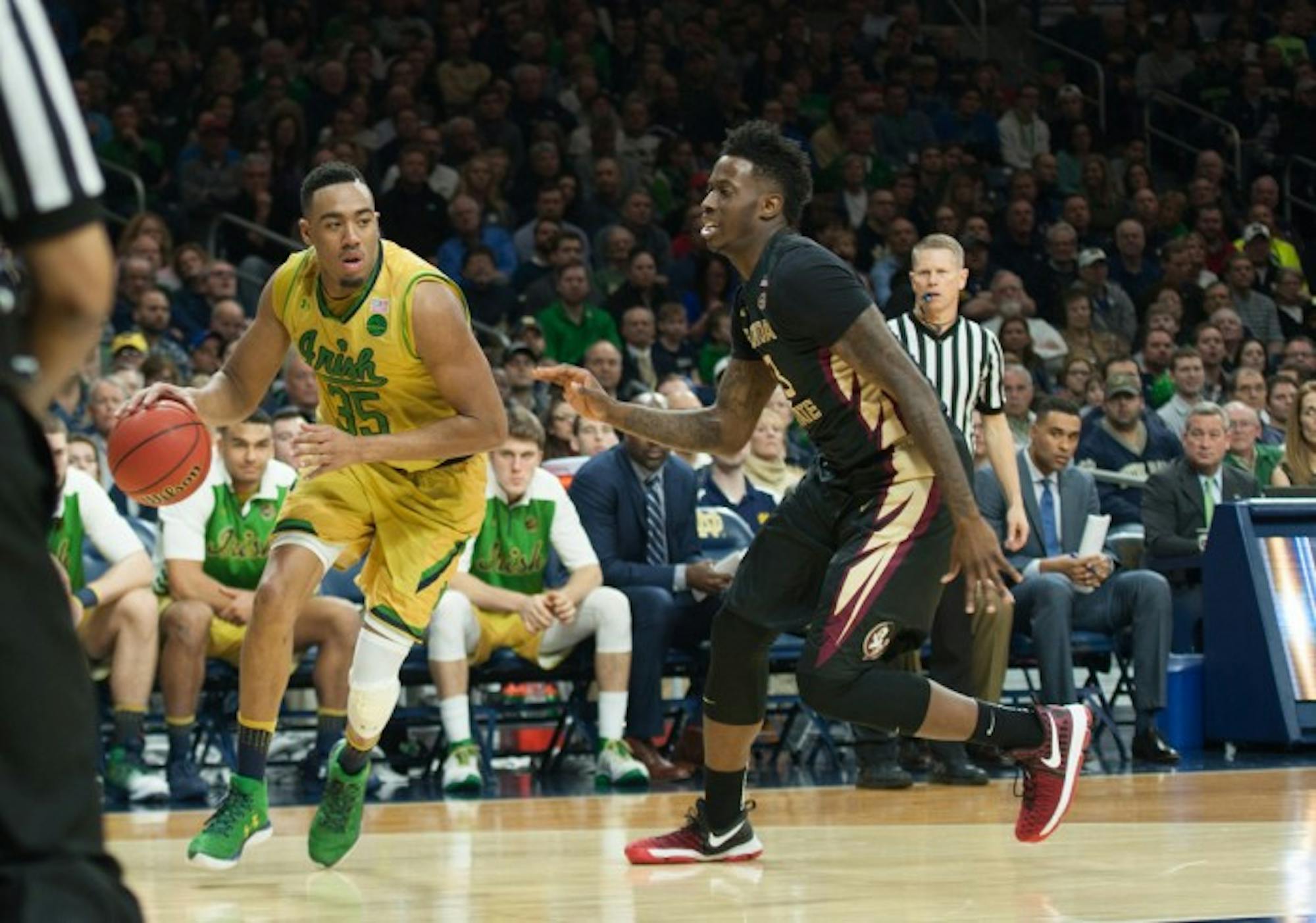 Irish junior forward Bonzie Colson looks to score against a Florida State defender during Notre Dame's 84-72 victory over the Seminoles on Saturday at Purcell Pavilion. Colson had a career-high 33 points in the game.