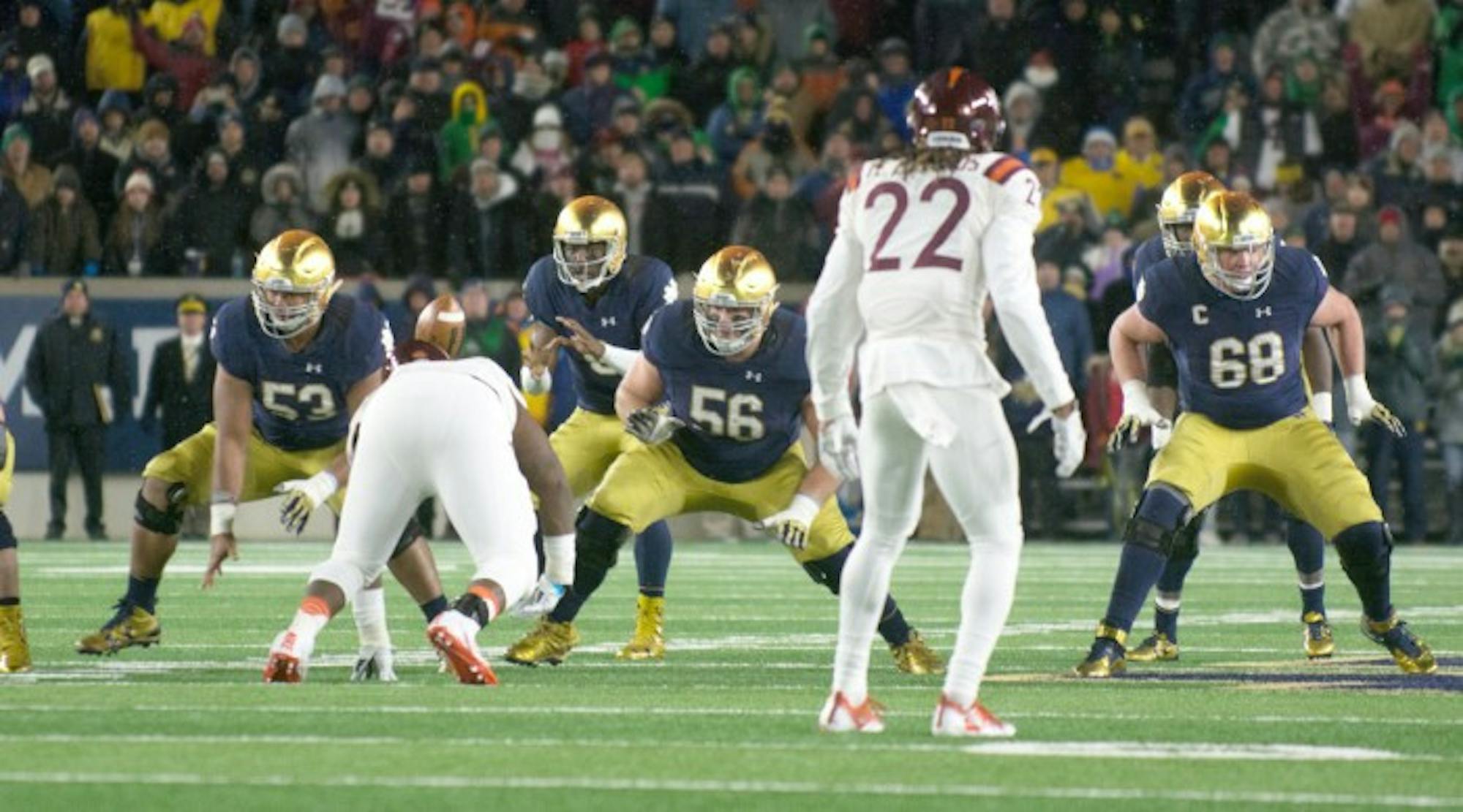 Irish senior offensive lineman Quenton Nelson, center, and graduate student offensive lineman Mike McGlinchey, right, drop back in pass protection after a snap during Notre Dame’s 34-31 loss to Virginia Tech on Nov. 19 at Notre Dame Stadium. Both Nelson and McGlinchey started all 12 games last season and are captains for the Irish this year.