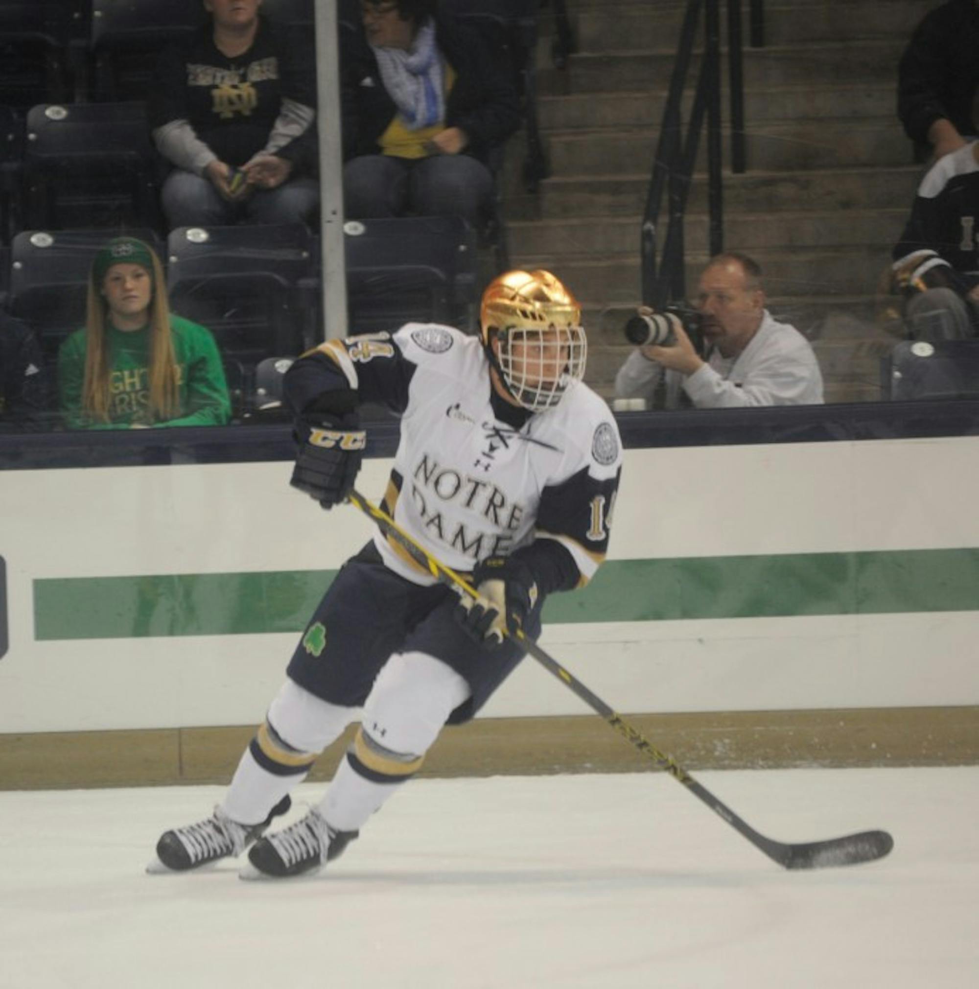 Irish junior center Thomas DiPauli turns toward the puck in Notre Dame’s loss Sunday. DiPauli tallied  a first-period goal in the game.