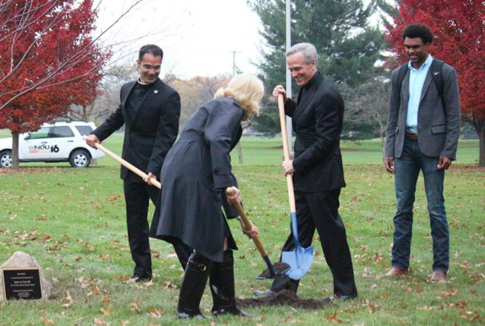 Br. Jesus Alonso, College President Jan Cervelli, University President Fr. John Jenkins and Notre Dame student body President Corey Robinson participate in the planting of the Trinity Tree on Tuesday.