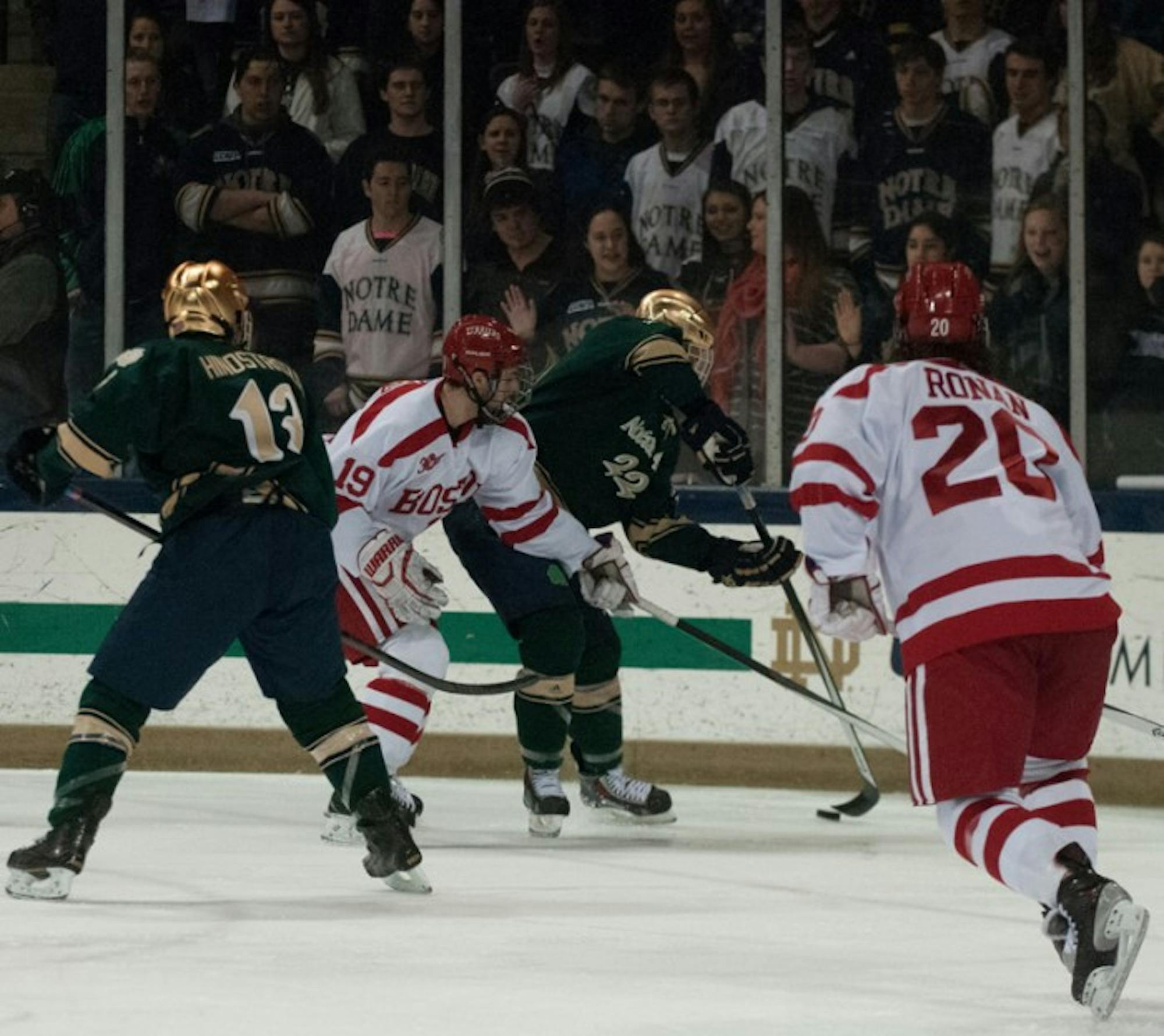 Irish sophomore wing Mario Lucia corrals the puck along the boards during Notre Dame’s 2-0 victory over Boston University on Feb. 22.