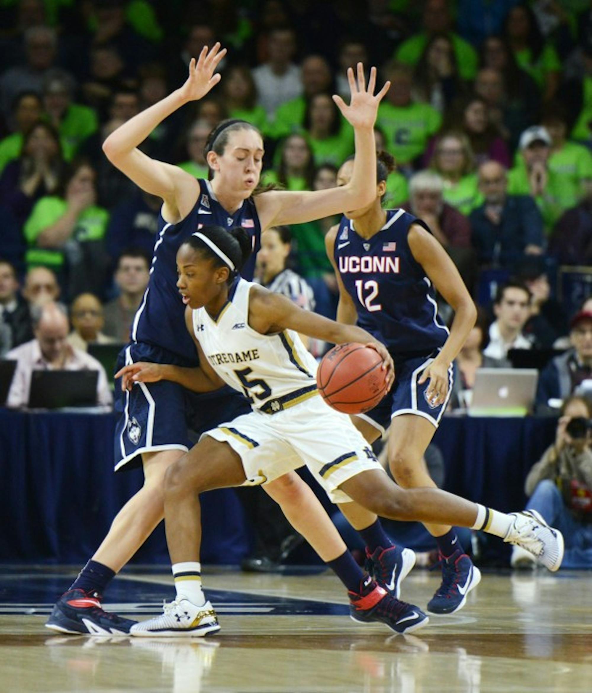 Irish guard Lindsay Allen tries to get around Huskies junior forward Breana Stewart during Notre Dame’s 76-58 loss to Connecticut on Saturday at Purcell Pavilion.