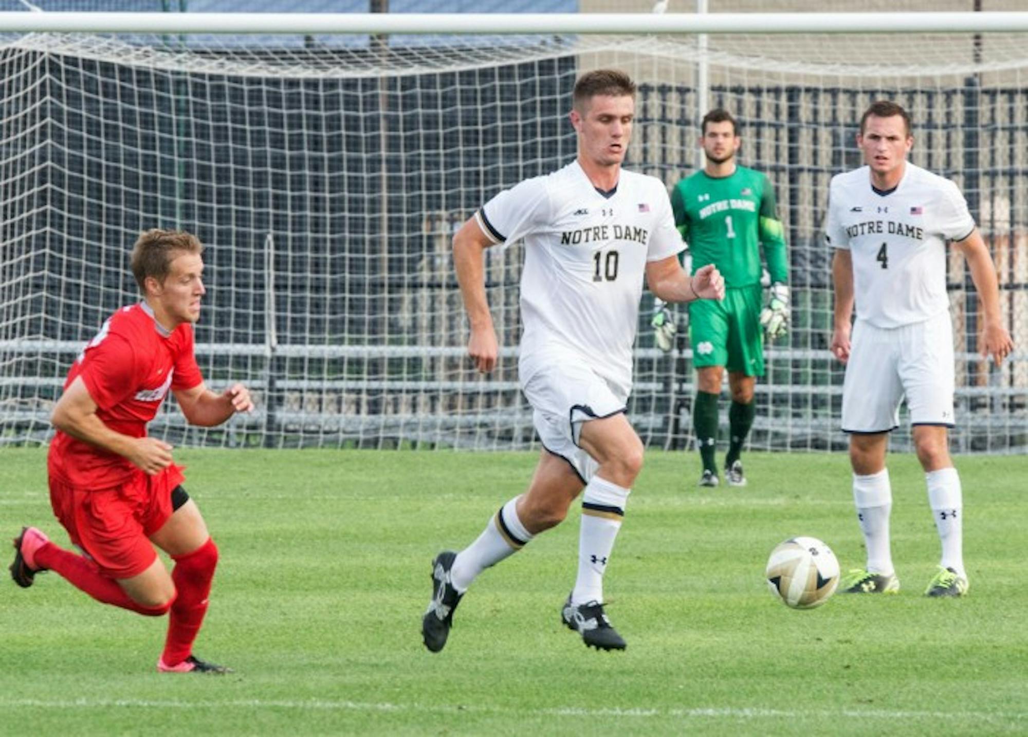 Senior defender Brandon Aubrey dribbles past a New Mexico player during a game at Alumni Stadium on Aug. 28. The Irish won 1-0 and were crowned champions of the Mike Berticelli Memorial Tournament.