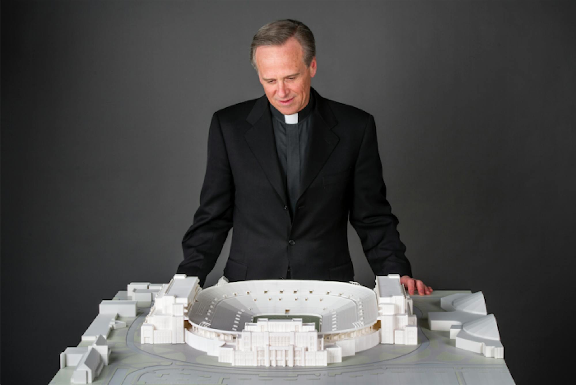 Fr. John Jenkins surveys a model for the Stadium expansion that was presented to the Board of Trustees for approval on Jan. 29.