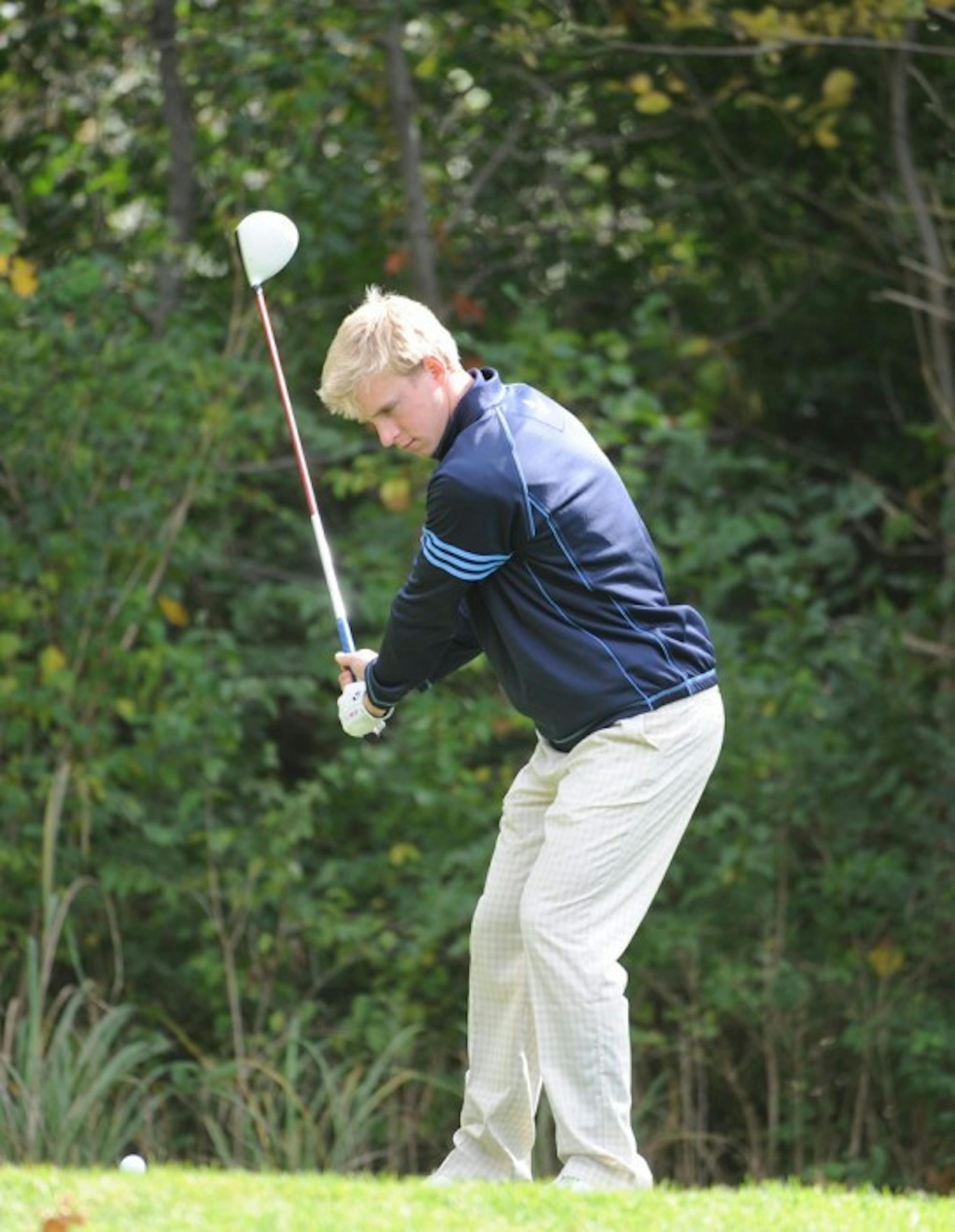 Junior Patrick Grahek tees off at the Fighting Irish Gridiron Golf  Classic at the Warren Golf Course on Oct. 9, 2012.