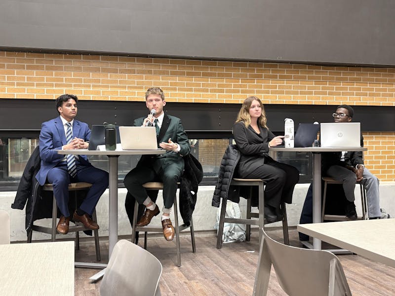 Presidential candidates spar in public debate