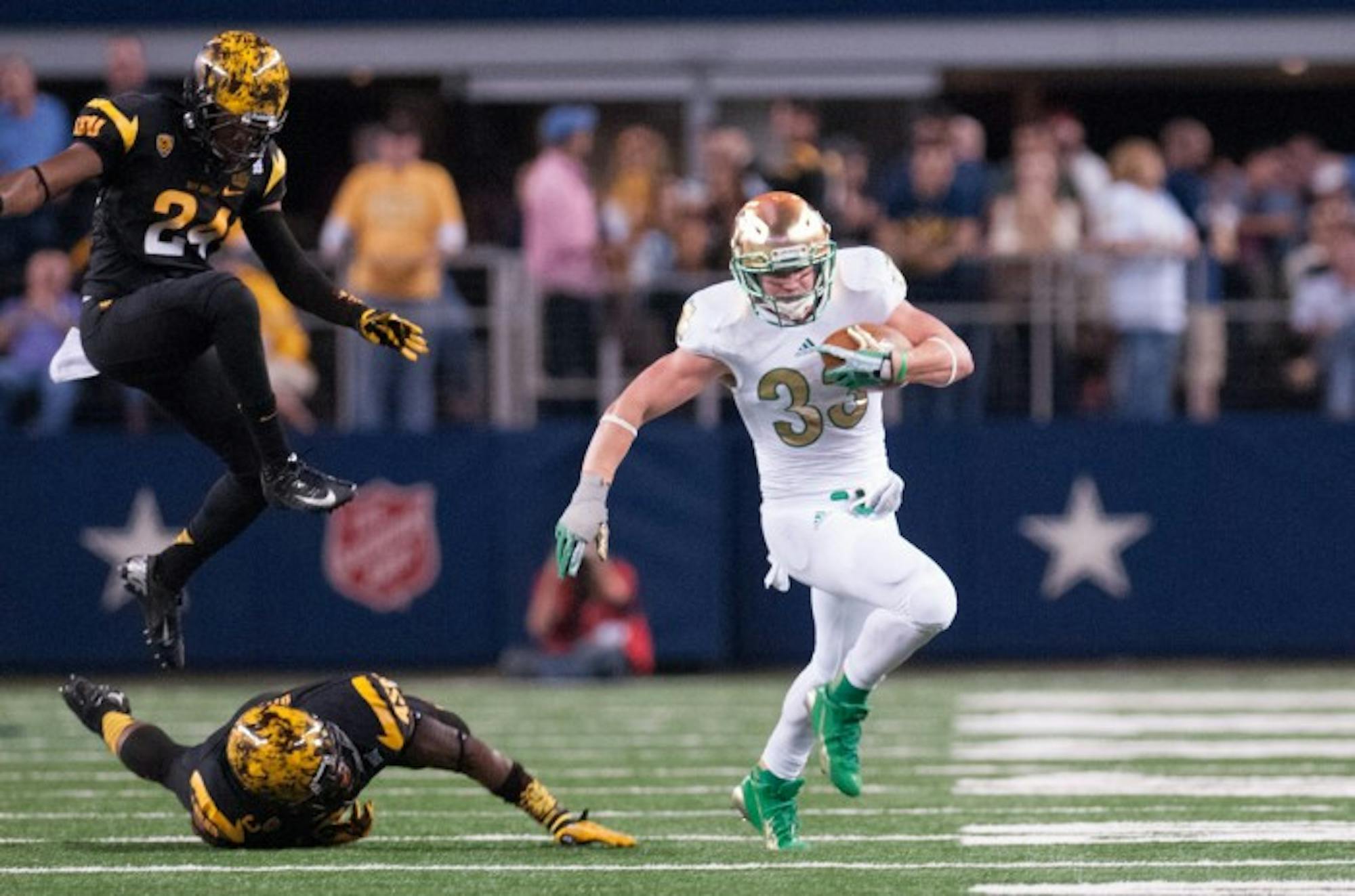 Irish senior running back Cam McDaniel evades two Arizona State defenders during Notre Dame's 37-34 win over the Sun Devils on Oct. 5 at AT&T Stadium in last year's Shamrock Series.