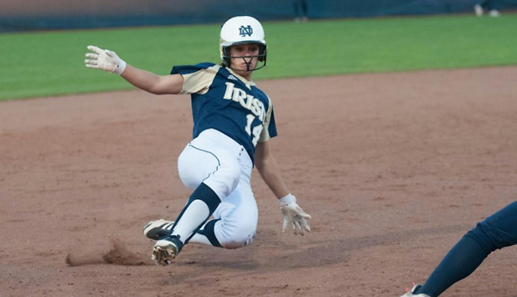 Irish senior outfielder Monica Torres slides into third base ahead of the throw during a scrimmage on Oct. 9, 2013.