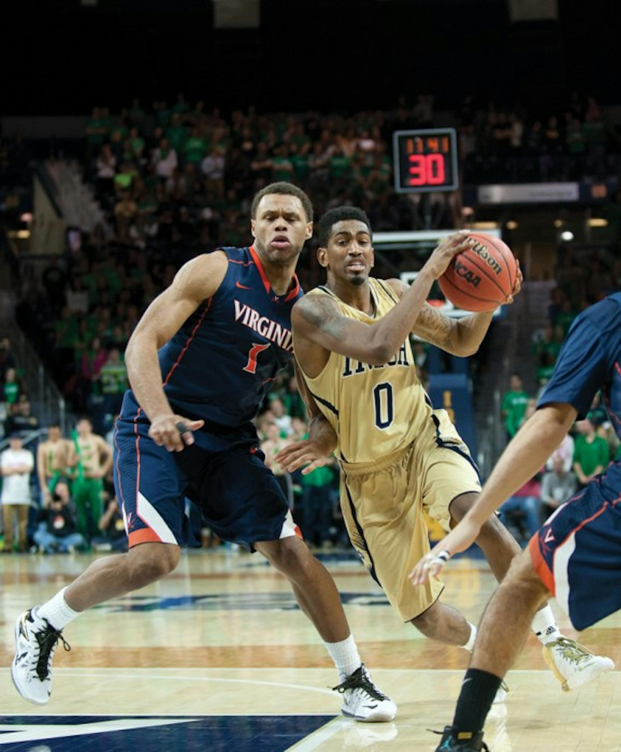 Senior guard Eric Atkins drives during Notre Dame’s 68-53 loss to Virginia on Jan. 28. Atkins leads the Irish in total assists this season.