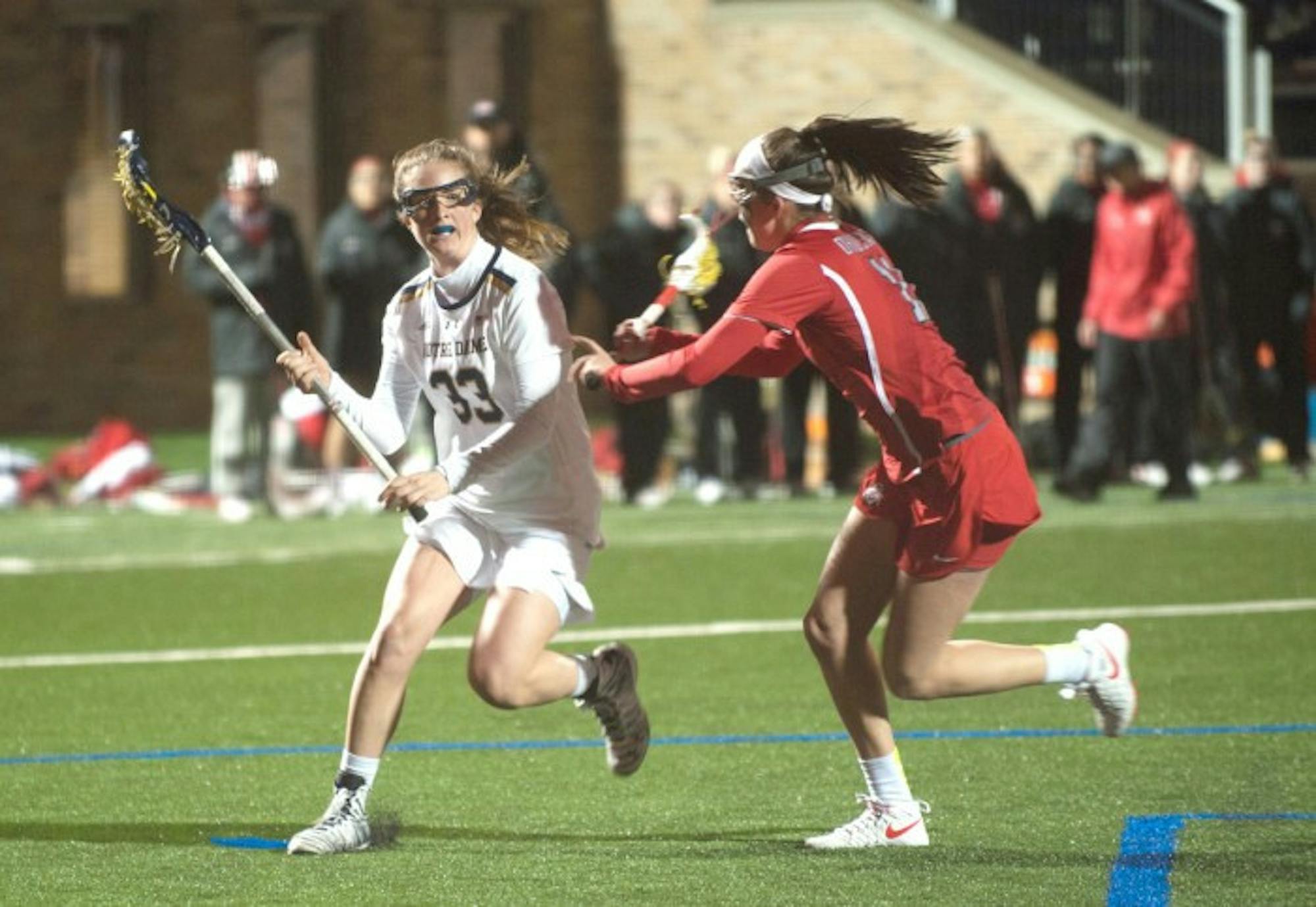 Irish sophomore attack Samantha Lynch dodges a defender during Notre Dame's 16-13 win over Ohio State on March 7 at Arlotta Stadium.
