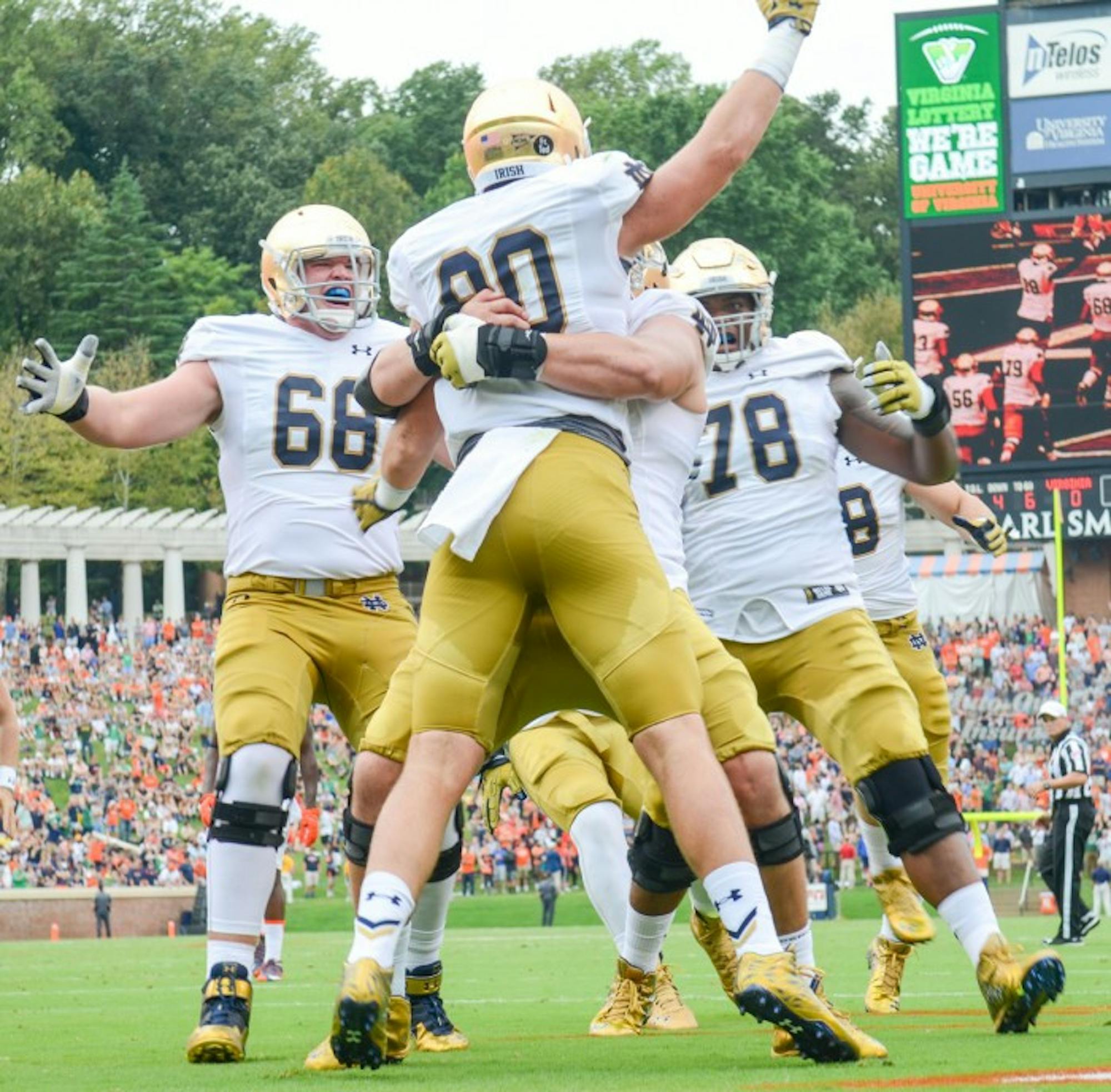 Notre Dame junior tight end Durhma Smythe celebrates after a score during Saturday's 34-27 win over Virginia at Scott Stadium.