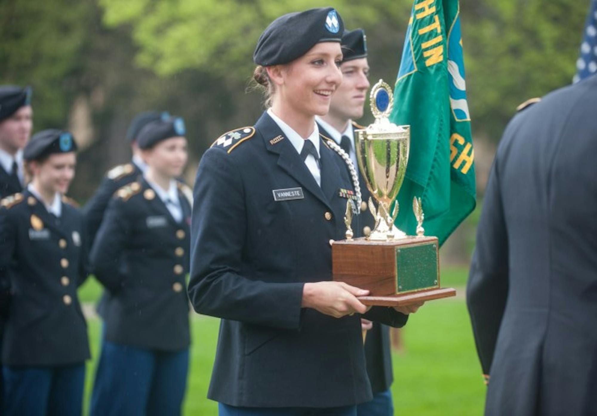 Saint Mary's senior and Army battalion commander Emilie Vanneste accepts an award at the ROTC Pass in Review ceremony Wednesday.