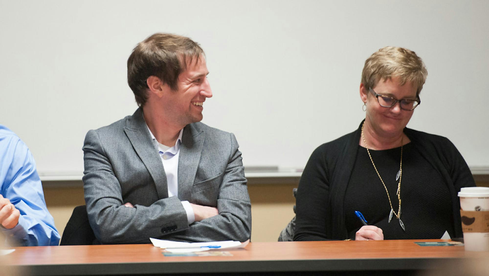 Panelists Kevin Donovan and Melissa Paulsen discuss effects of human dignity on developing countries.