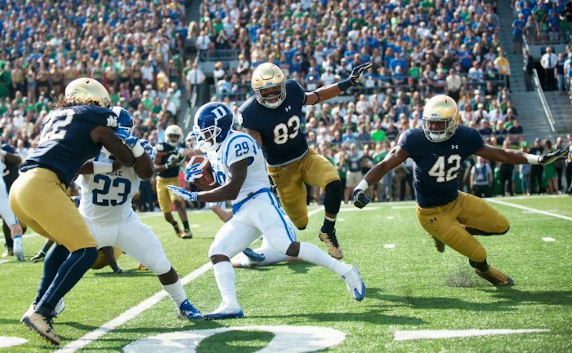 Irish sophomore linebacker Asmar Bilal tangles with a Duke defender in Notre Dame’s 38-35 loss to the Blue Devils on Saturday. Kelly said Tuesday that Bilal will see more playing time as the season progresses.