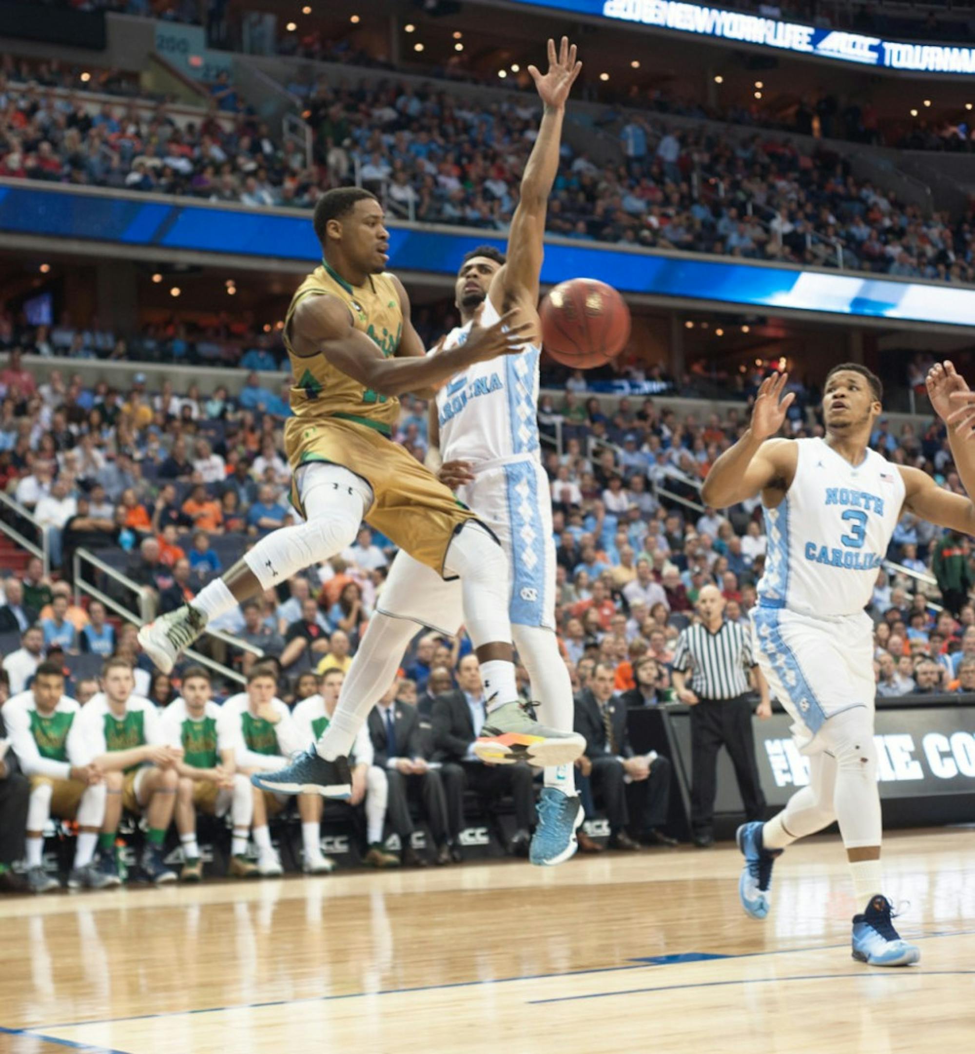 Former Irish junior guard Demetrius Jackson dishes out a pass around a defender during Notre Dame’s 78-47 loss to North Carolina on March 11 at the Verizon Center. Jackson has declared for the NBA Draft.