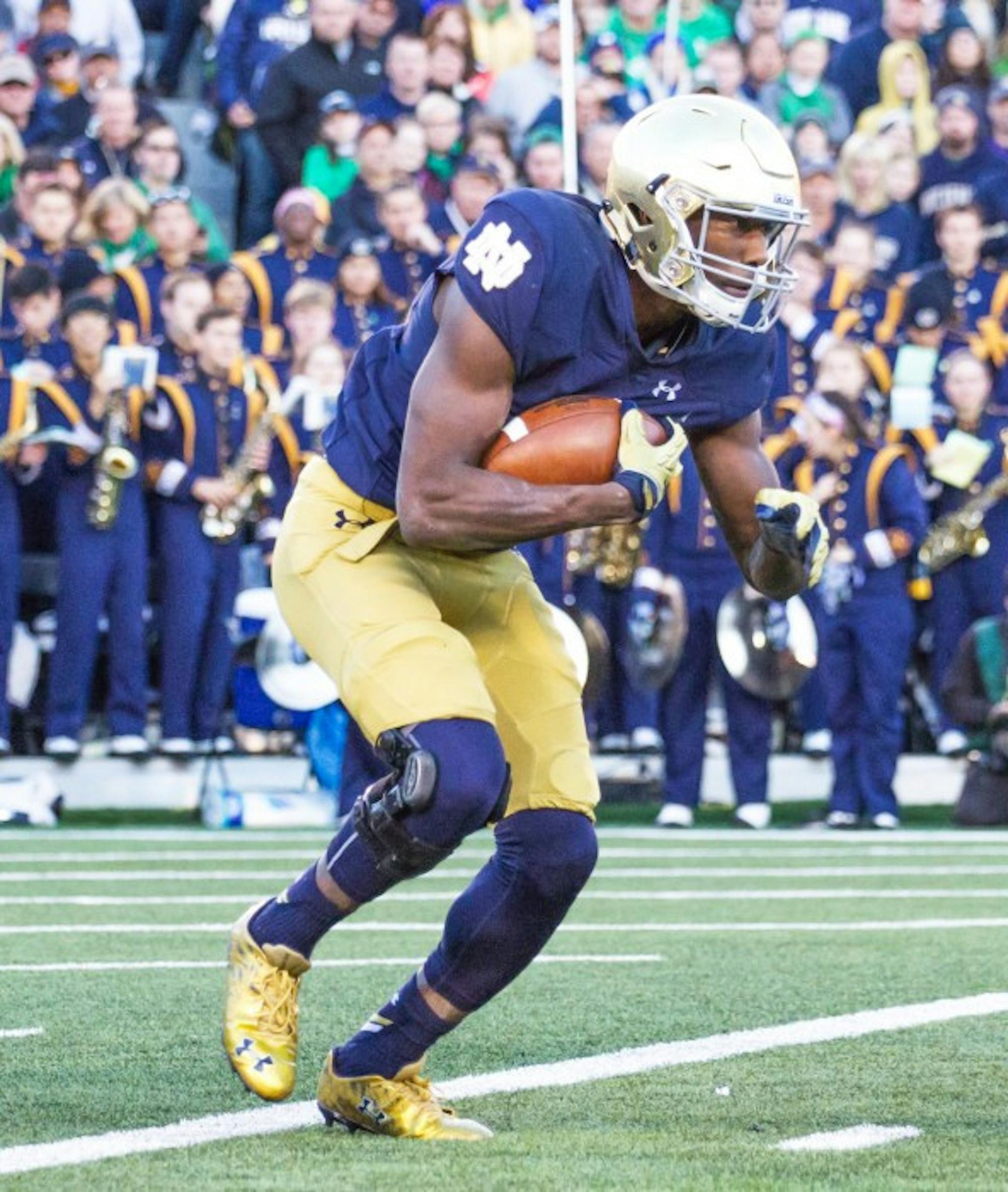 Freshman running back Josh Adams looks for a hole for a touchdown and an all-time Irish record for longest play from scrimmage.